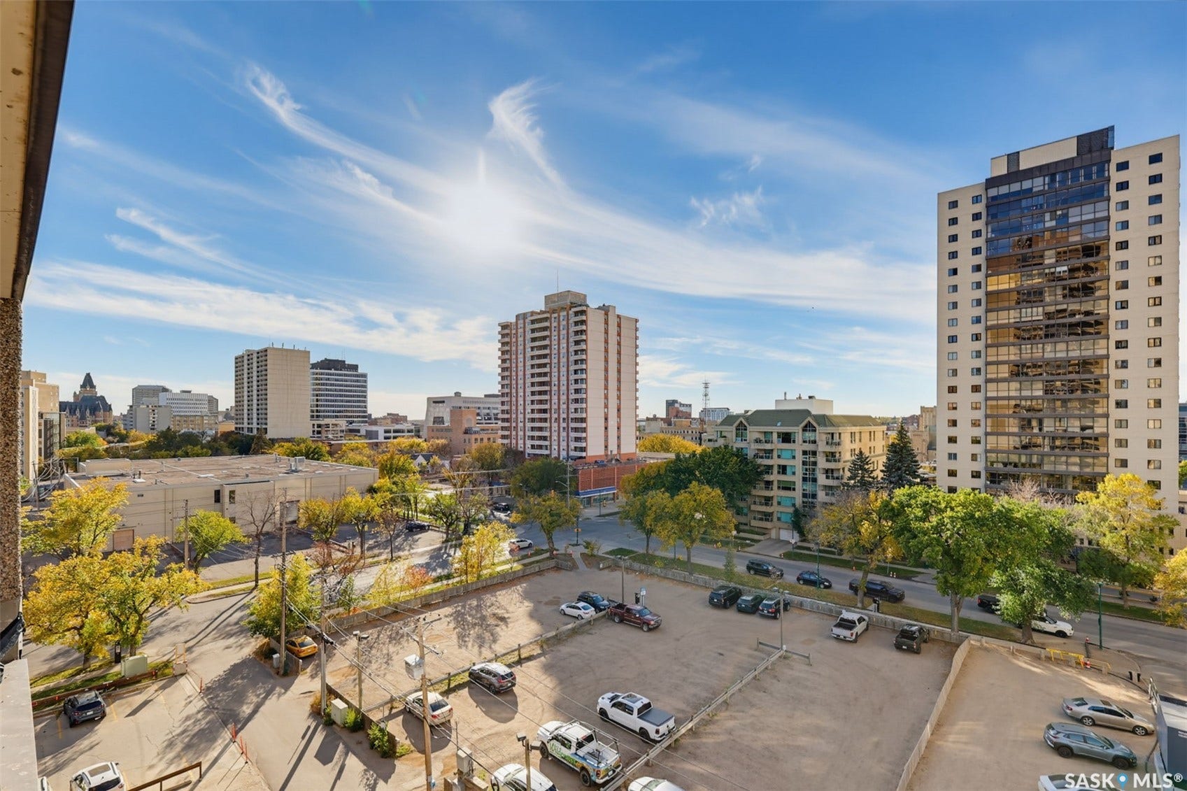 Urban skyline featuring multiple high-rise buildings and a variety of architectural styles