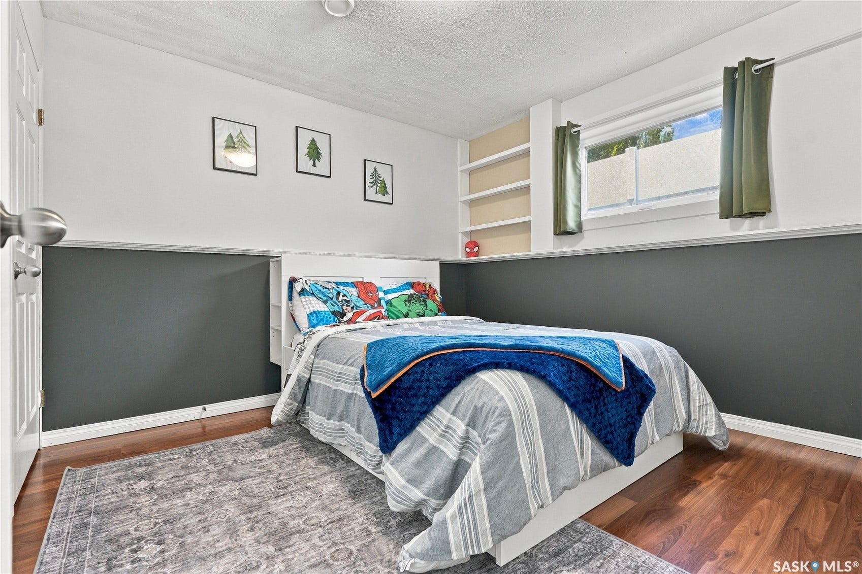 Built-in shelving, wood-finish flooring, and a window with natural light