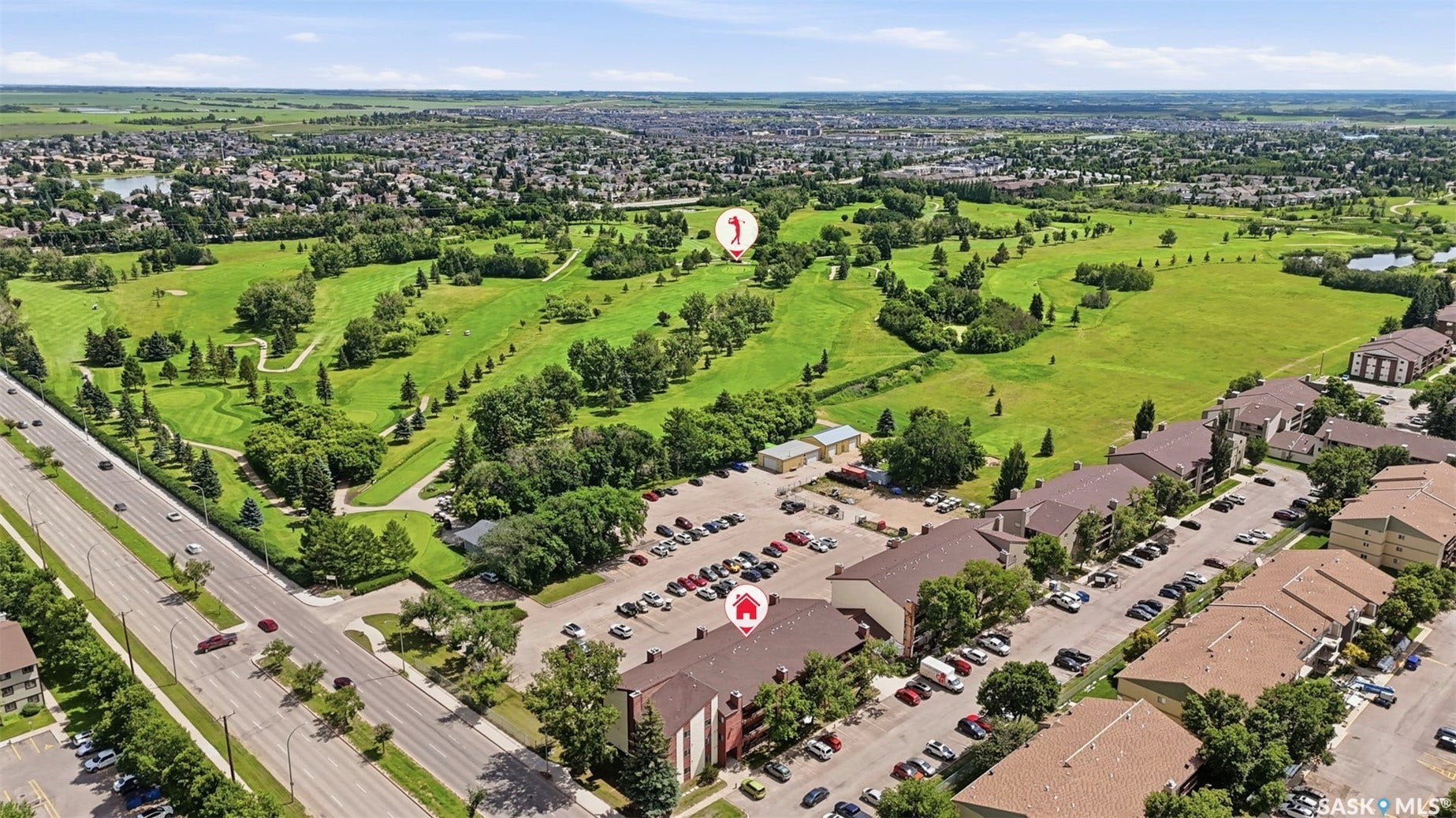 Expansive aerial perspective showcasing a residential development with multiple buildings