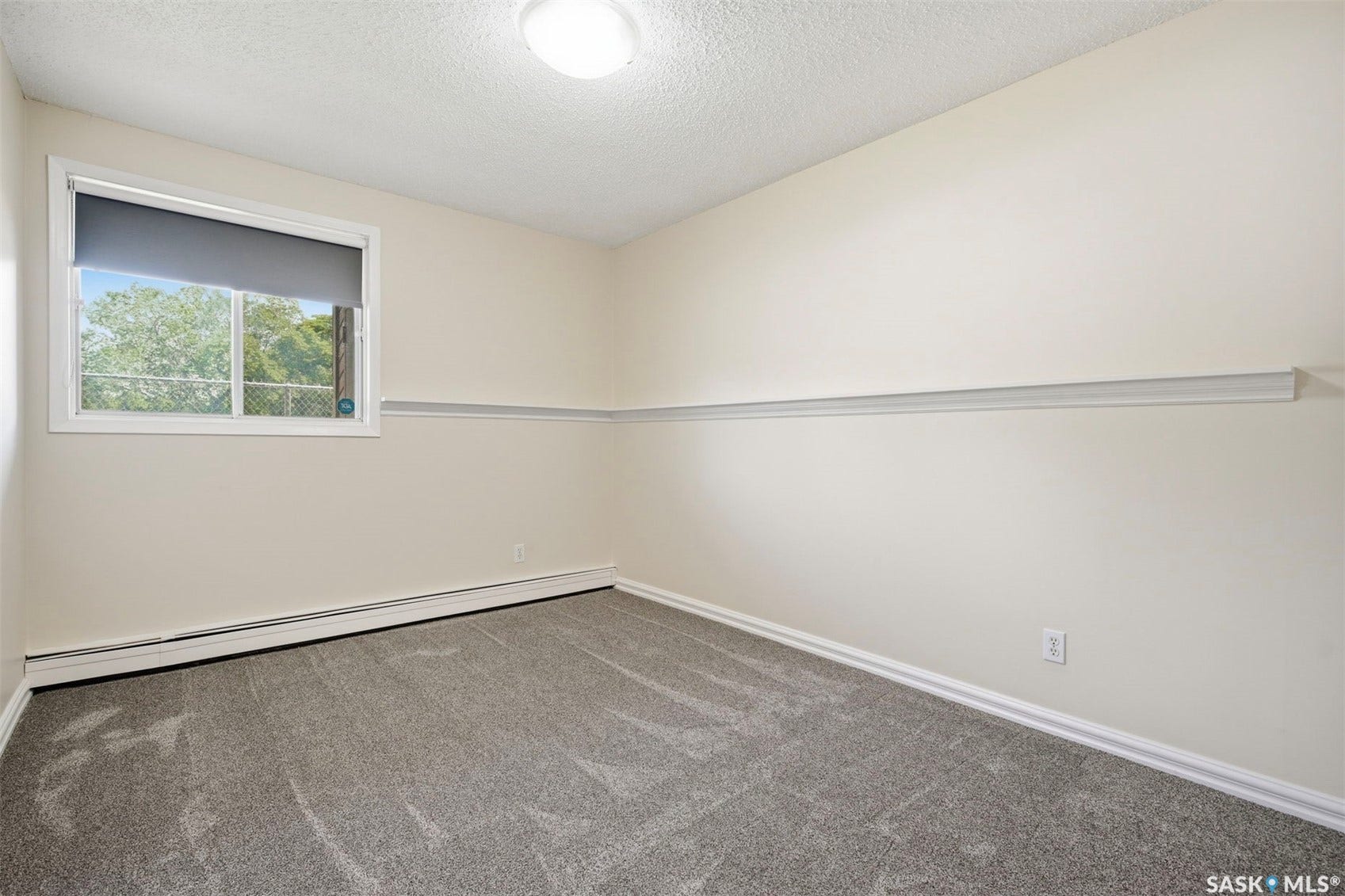 Neutral-toned walls with a decorative chair rail