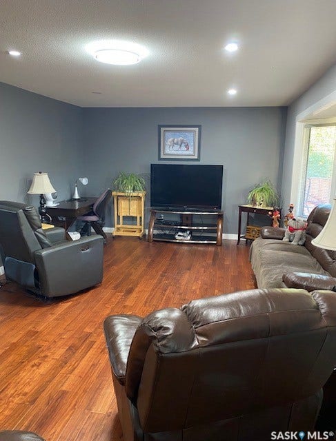 216 2nd Avenue, Wiseton SK S0L 3M0 Wood-finish flooring with recessed lighting and a central flush-mount light fixture