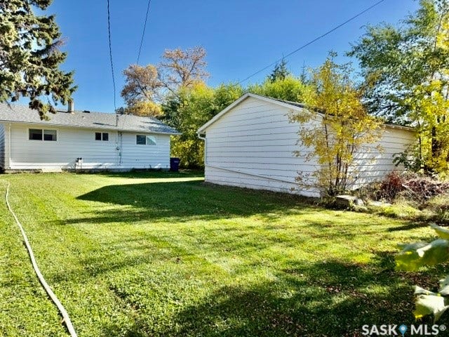 yard with dbl detached garage