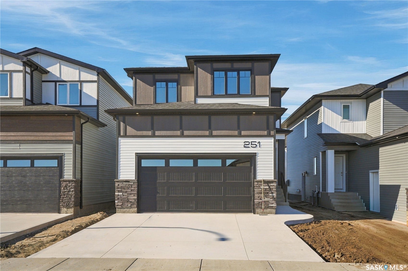 Modern exterior with horizontal siding and stone accents