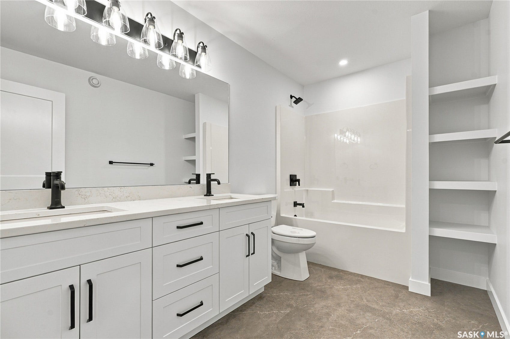 Spa-inspired primary bathroom featuring a dual-sink vanity with ample storage, quartz countertop, and matte black hardware