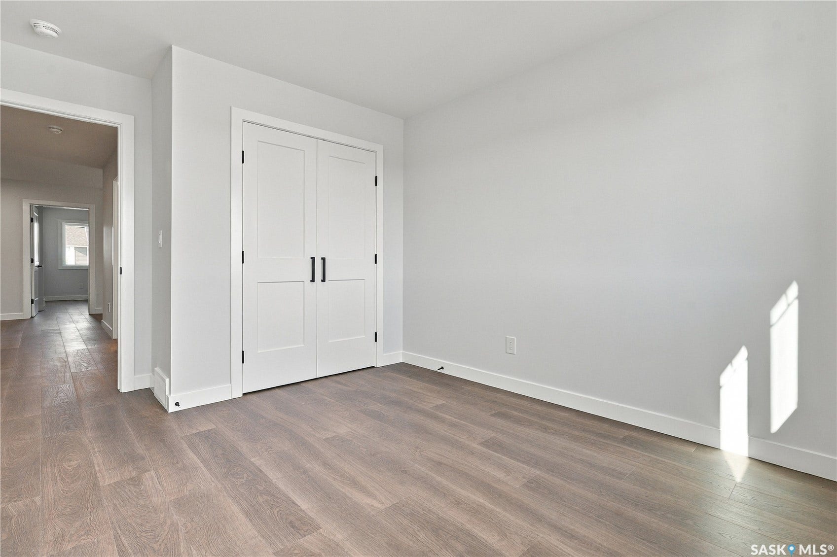 Wood-finish plank flooring throughout