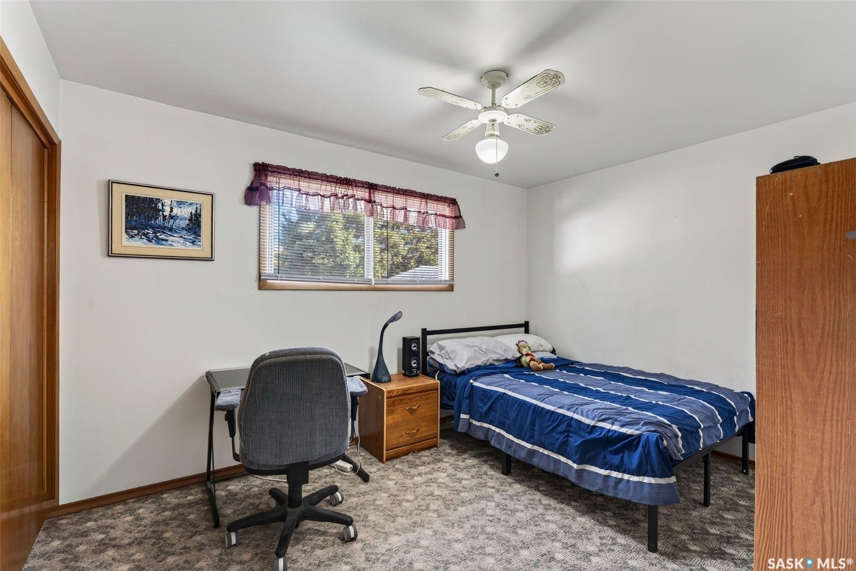 White walls, recessed window, and a ceiling fan with integrated lighting