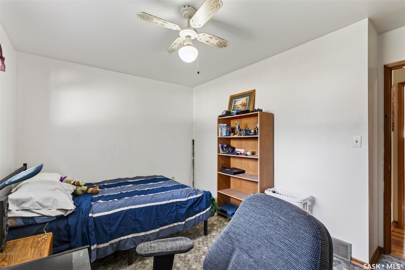 White painted walls with a ceiling fan light fixture
