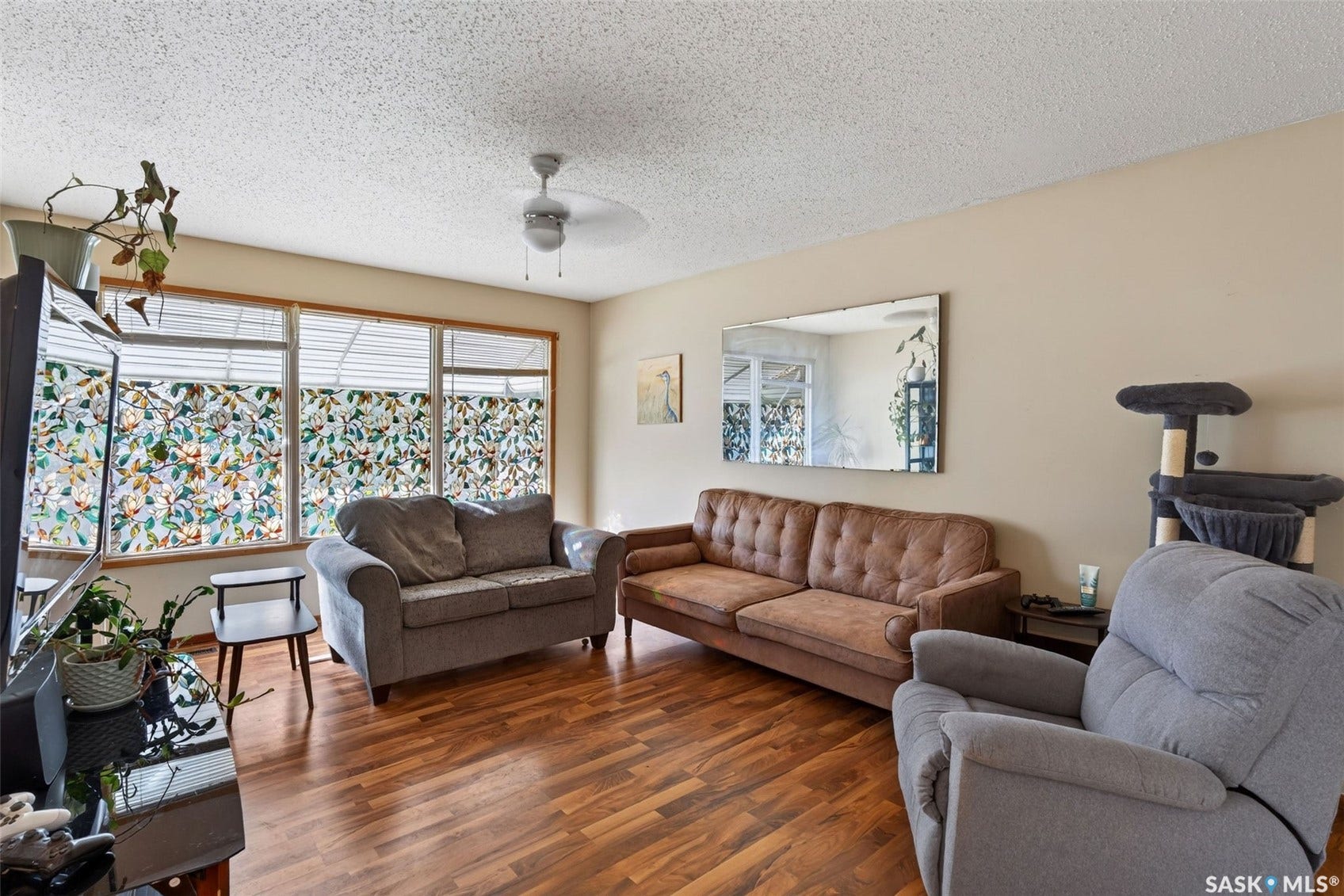 Wood-finish flooring throughout, complemented by neutral wall tones