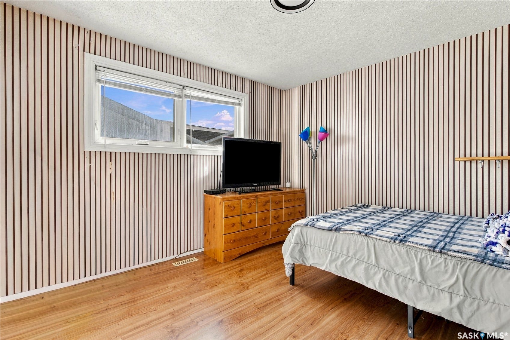 Wood-finish flooring with a textured wall treatment