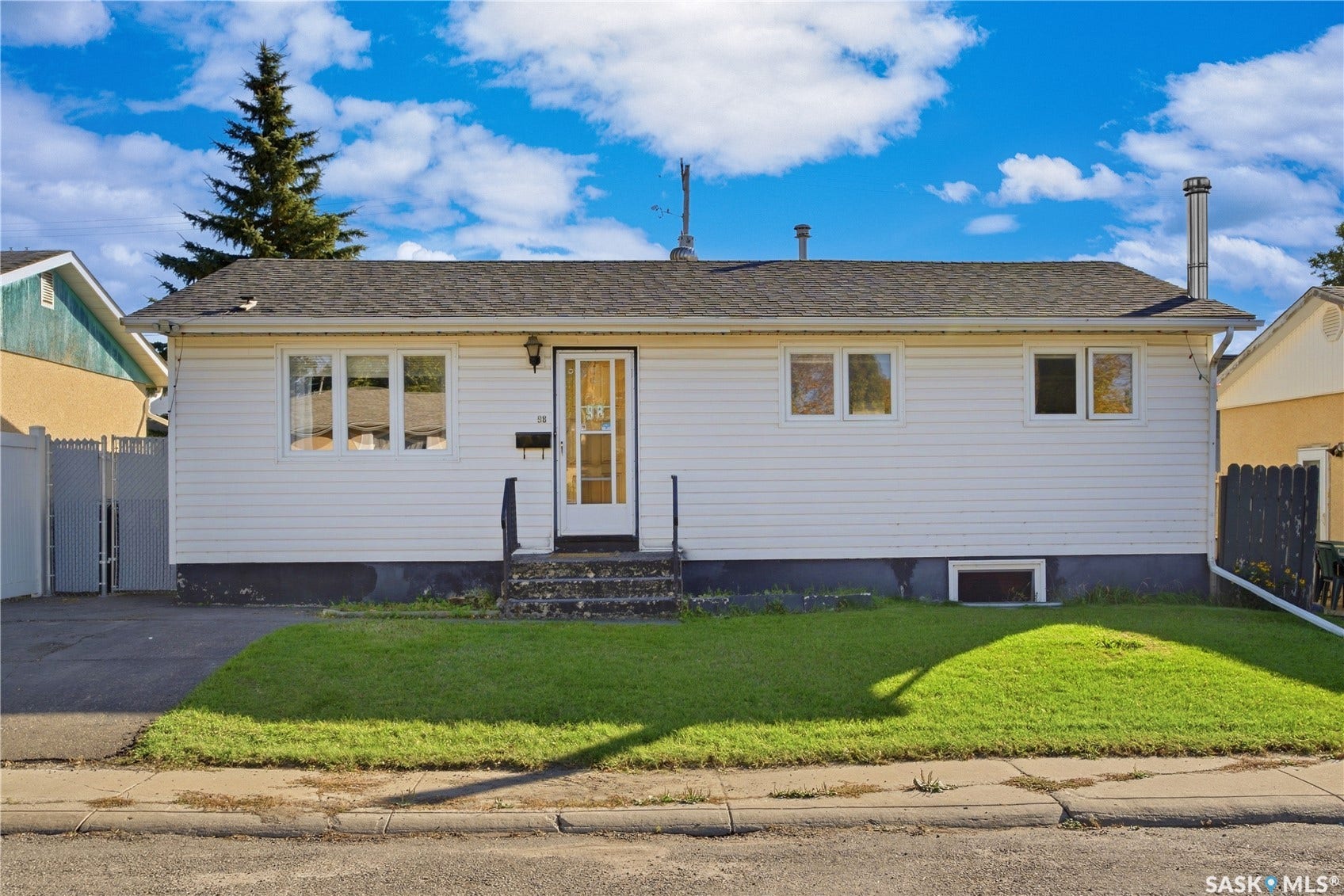 White horizontal siding exterior with a dark shingle roof