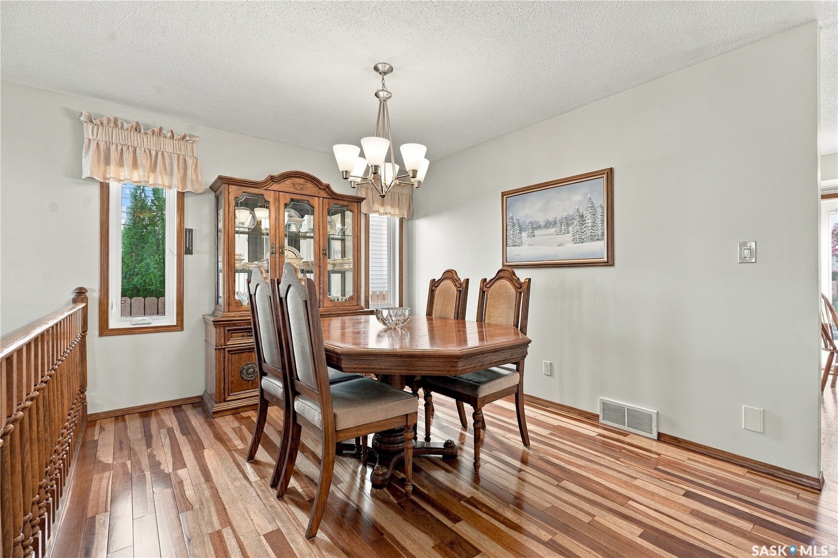 Wood-finish flooring throughout, complemented by light-toned wall paint