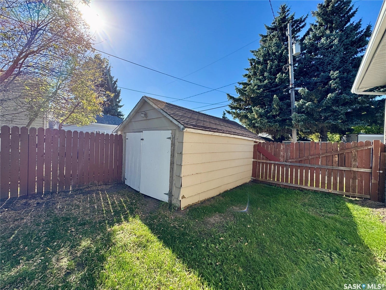 365 Keats Street, Southey SK S0G 4P0 Detached garage with horizontal siding, a gable roof, and double white entry doors