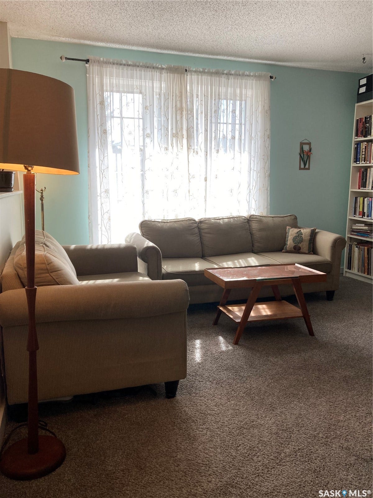 Wall-to-wall carpeting and built-in shelving unit