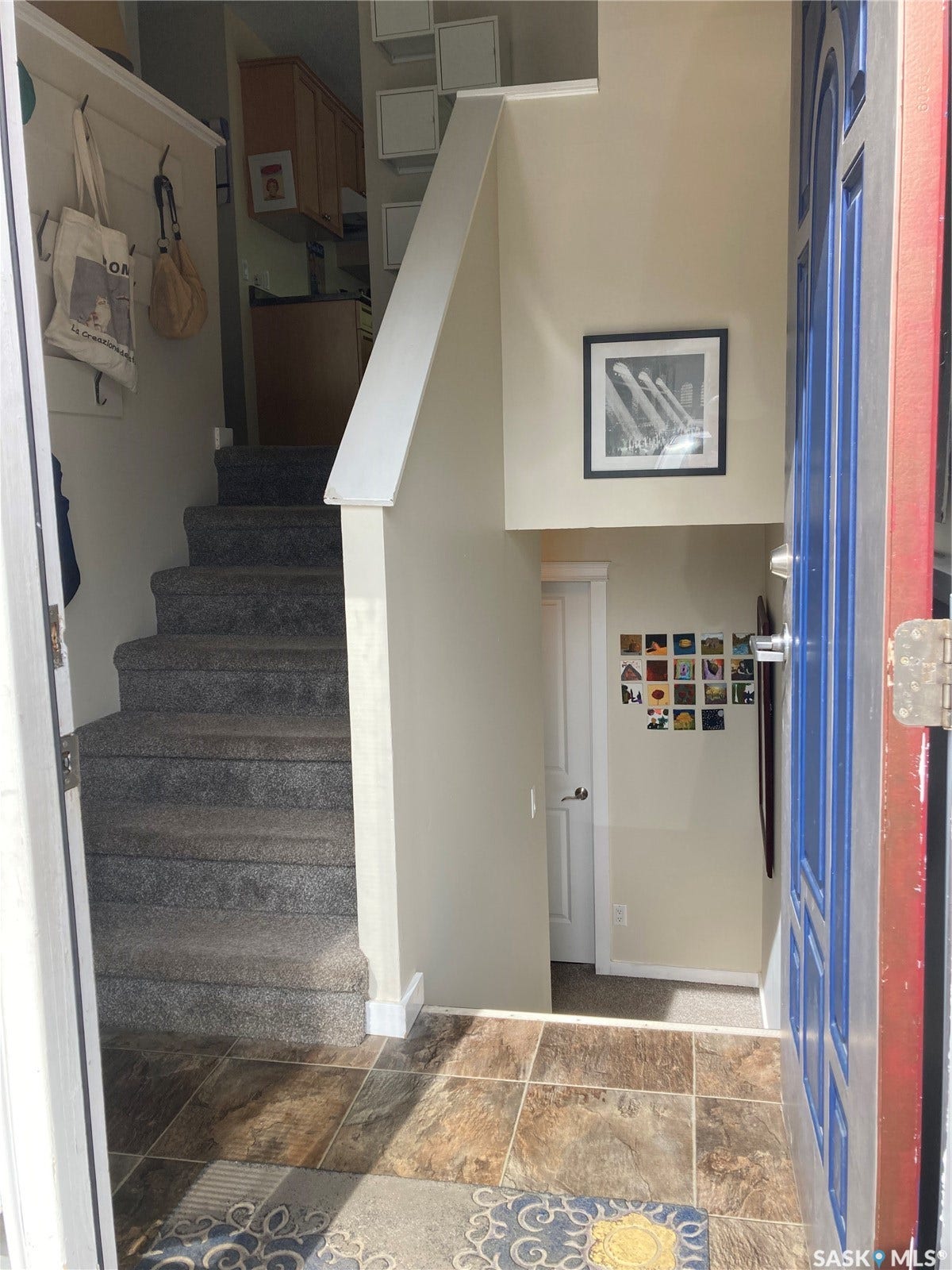 Foyer entry with multi-toned tile flooring
