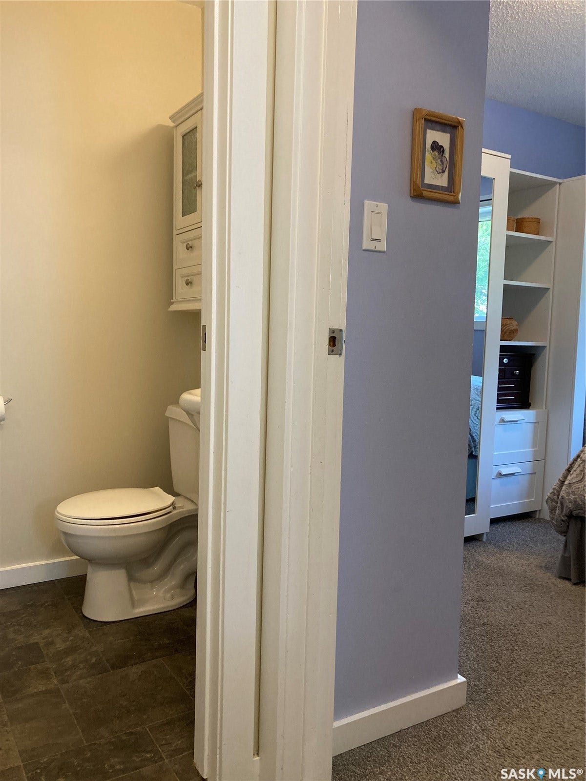 Wood-finish flooring with white baseboards