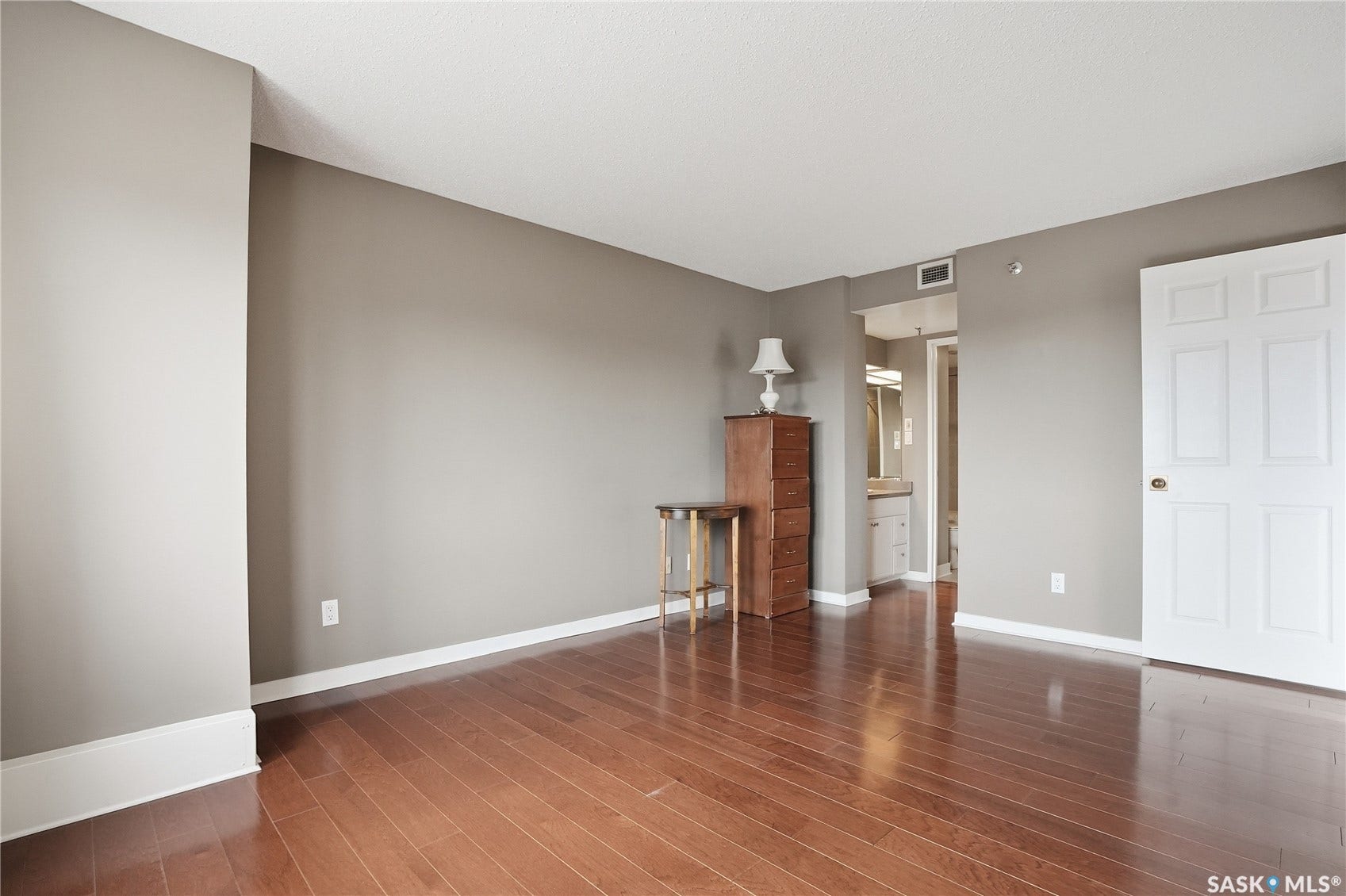 Warm wood-finish flooring with crisp white trim