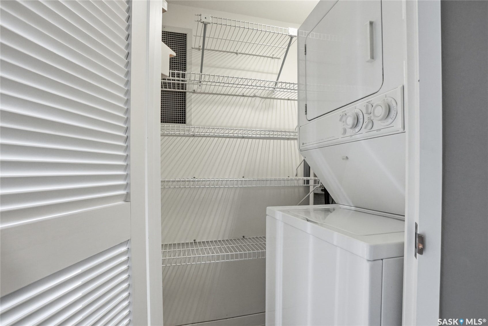 Integrated stackable washer and dryer, louvered bi-fold doors, and wire shelving system