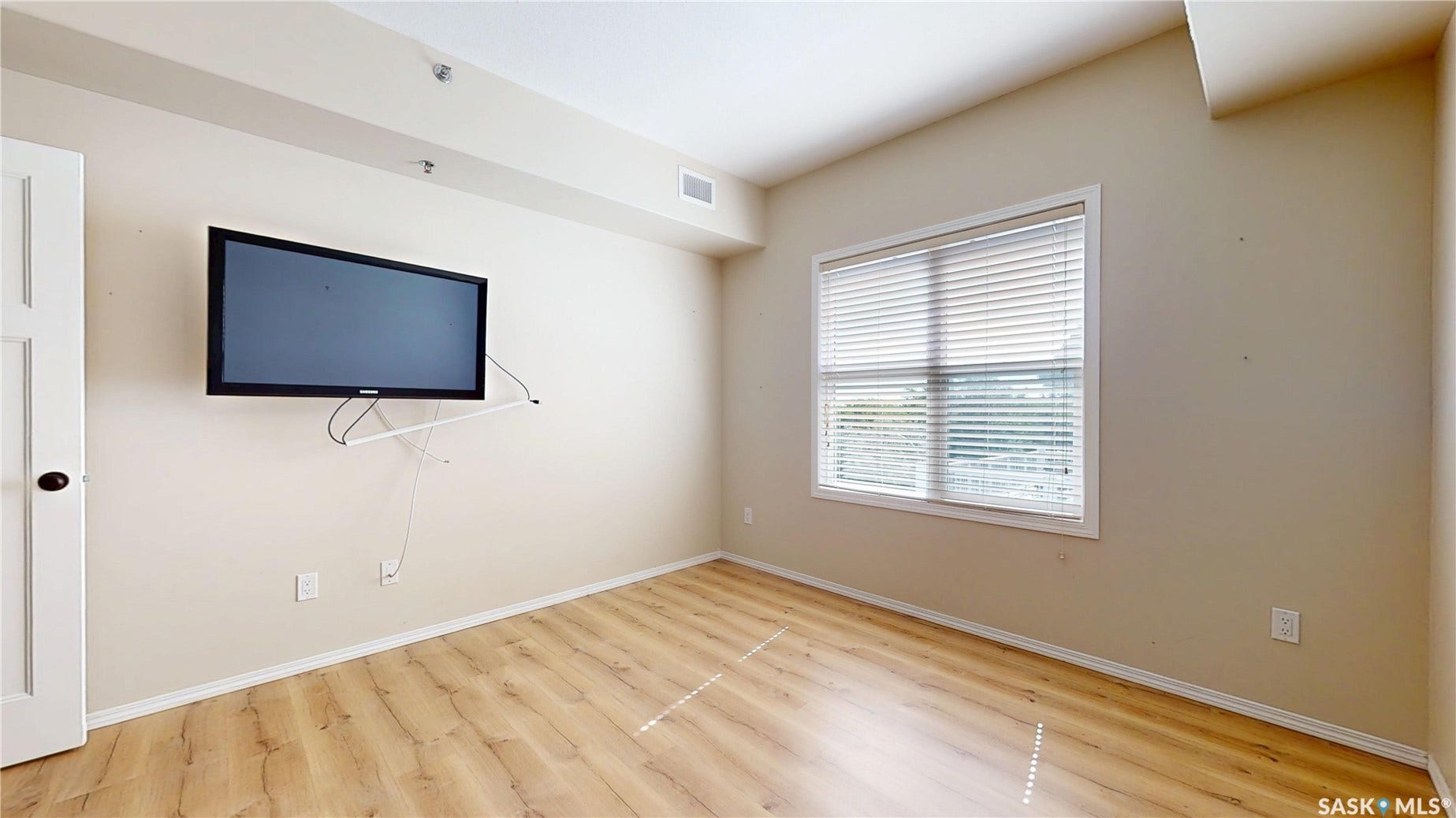 1220 Blackfoot Drive, #415, Regina SK S4S 6T2 The primary bedroom includes the tv