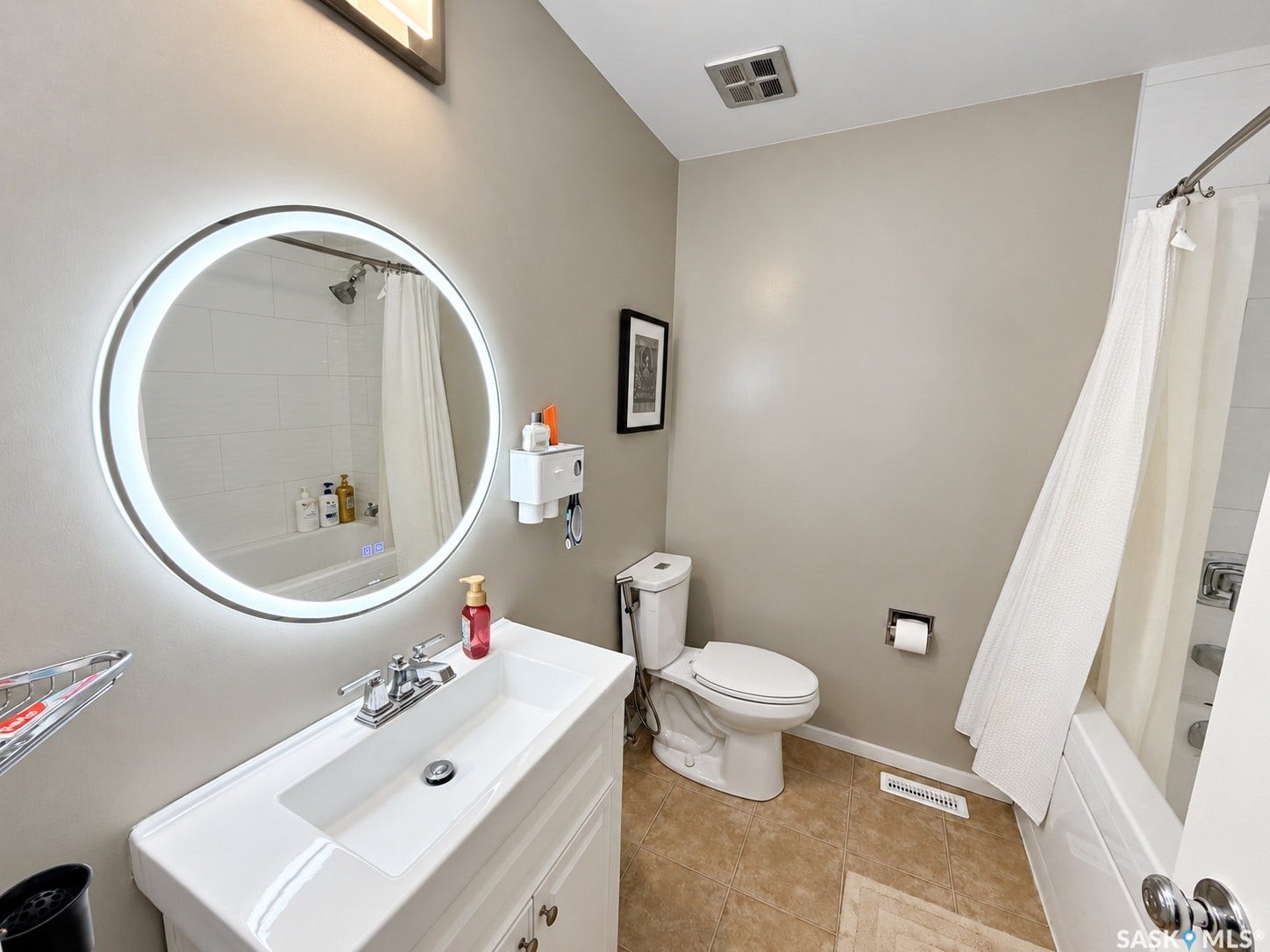 White vanity with an integrated sink and chrome faucet