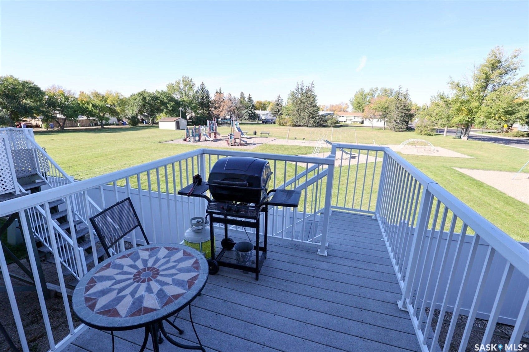 Upper-level deck with composite decking and white railings