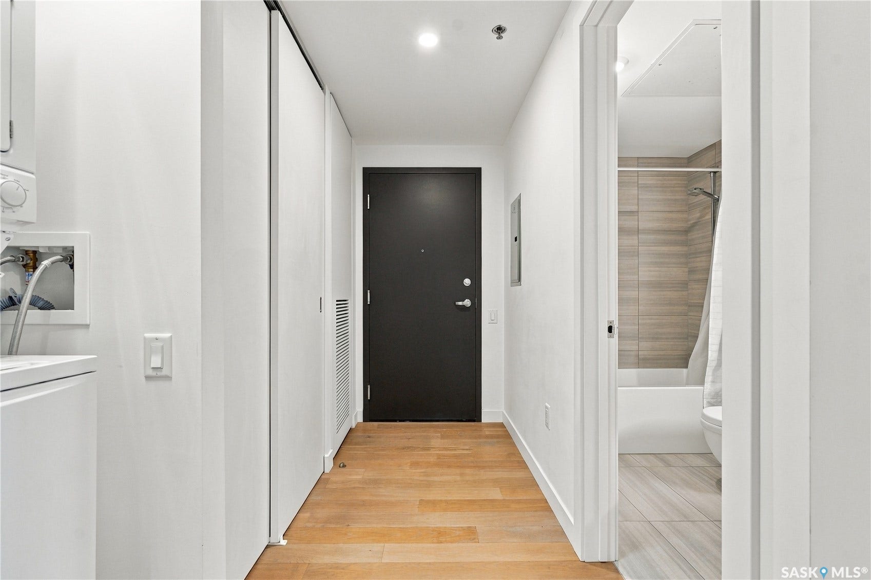 Wood-finish flooring throughout the hallway