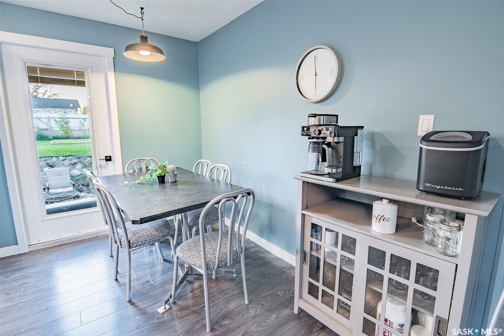 Wood-finish flooring with a light blue wall color