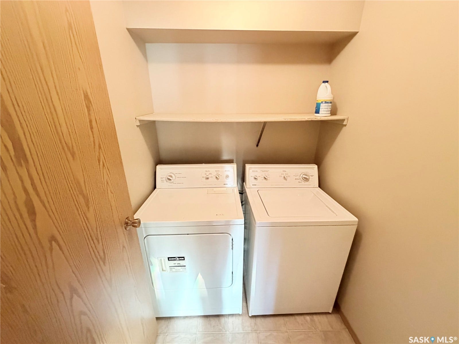 In-unit laundry appliances with overhead shelving