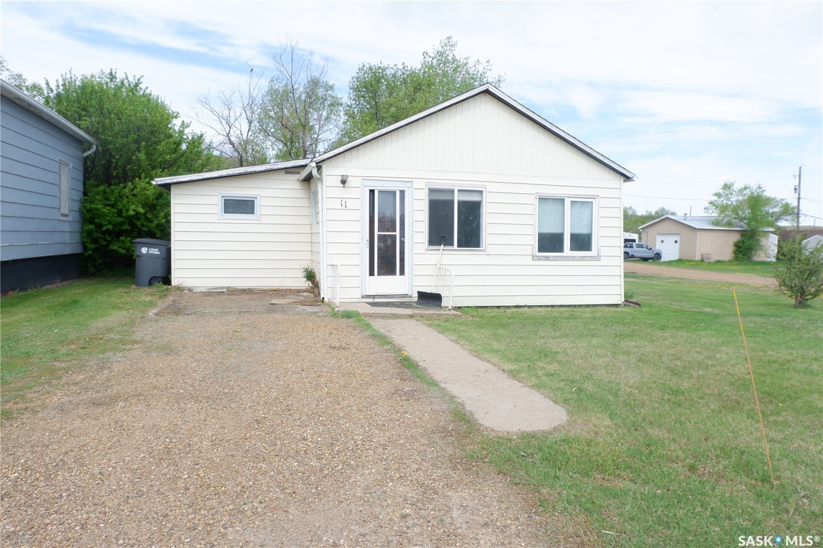 Back of house with a yard