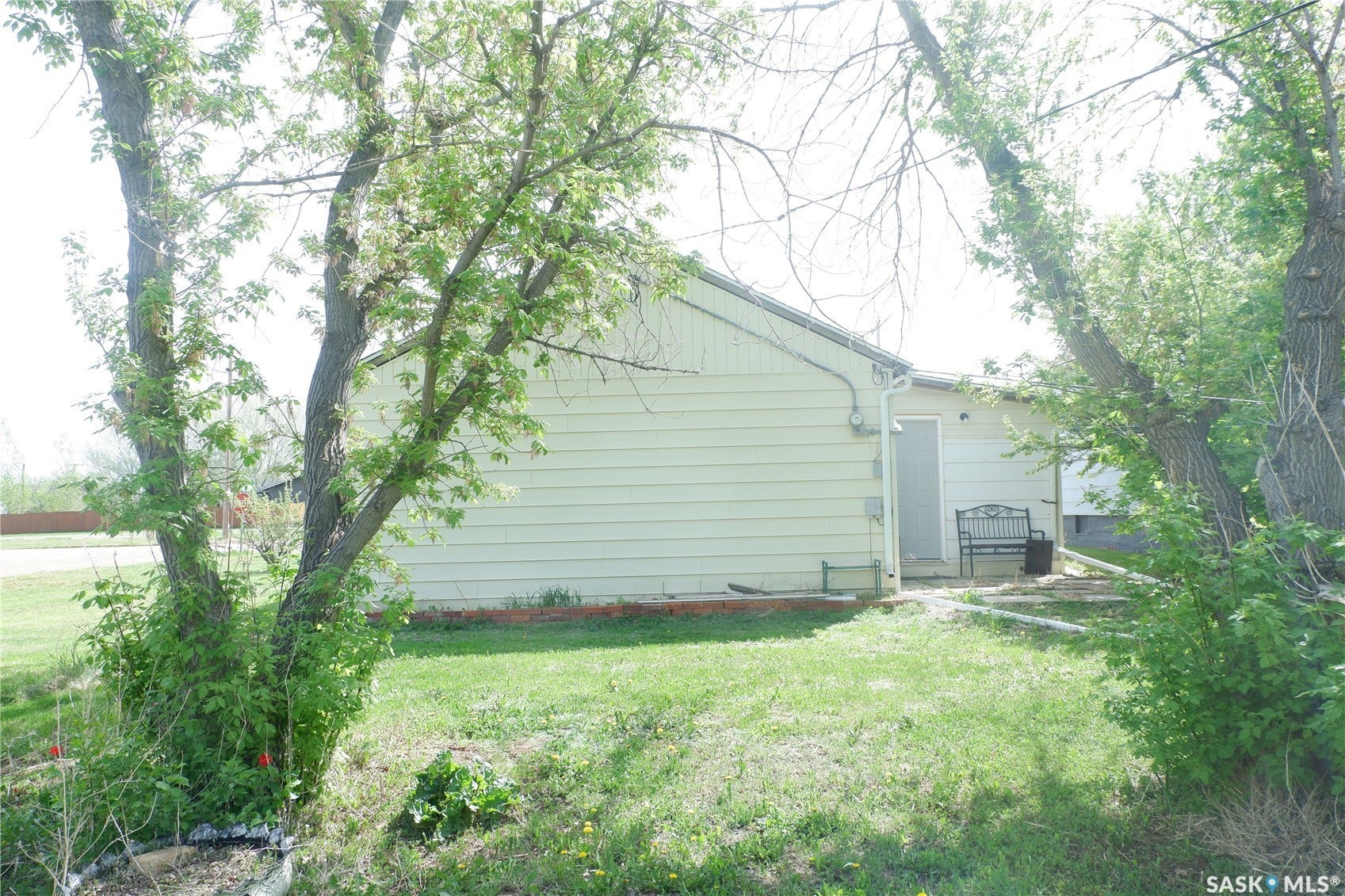 View of side of property with a yard