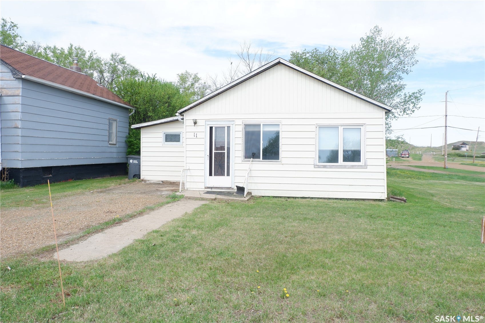 Rear view of property with a yard