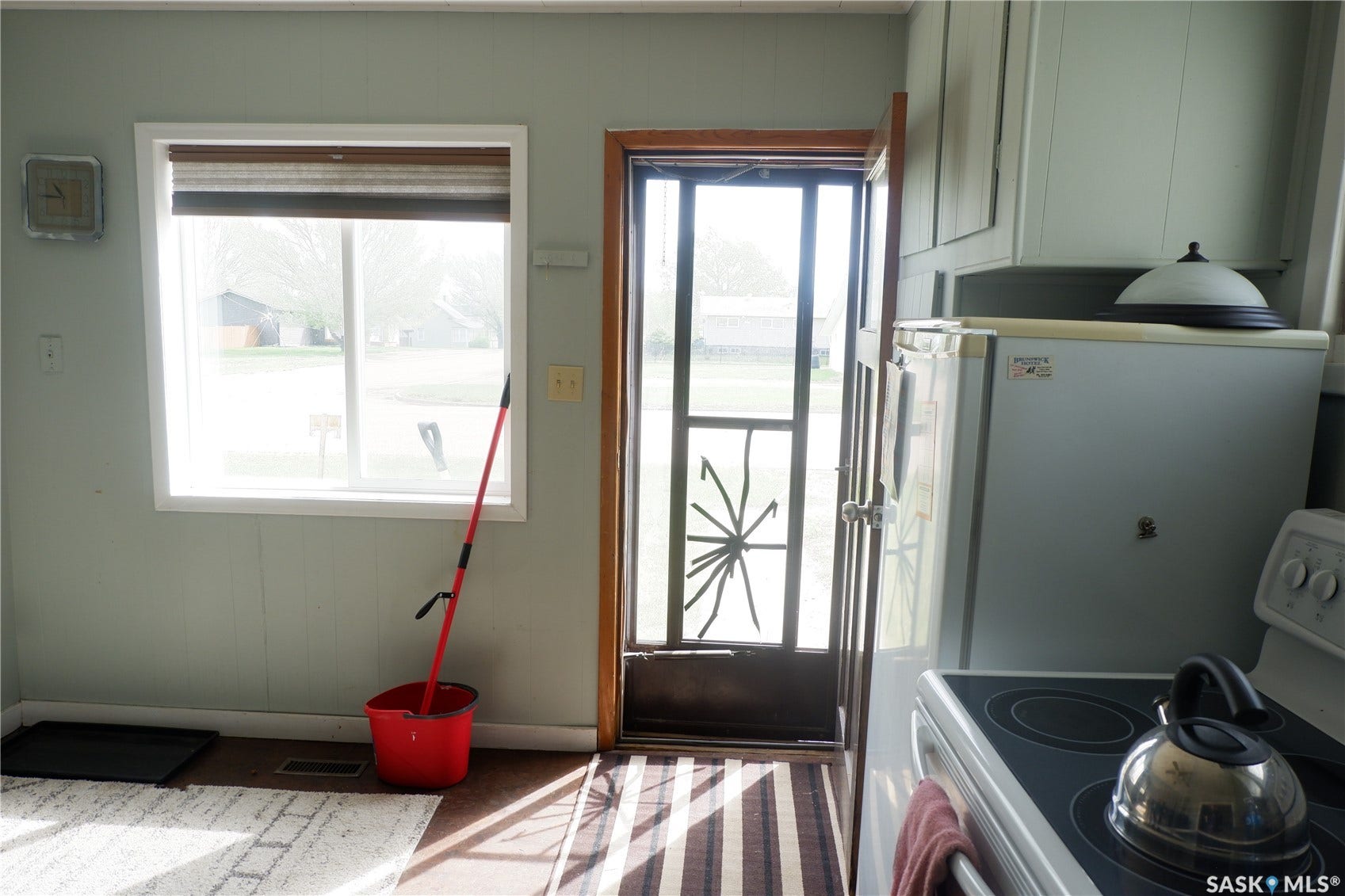 Doorway featuring baseboards