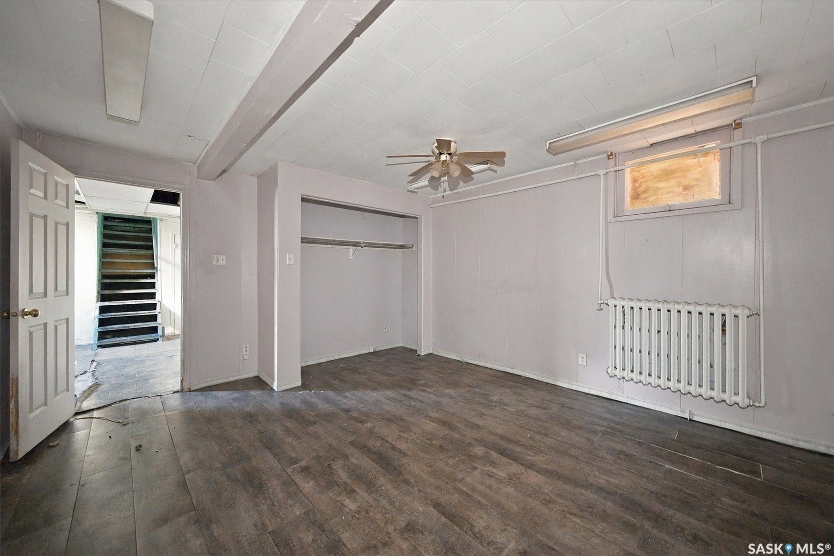 Wood-finish flooring, ceiling fan, and built-in closet storage