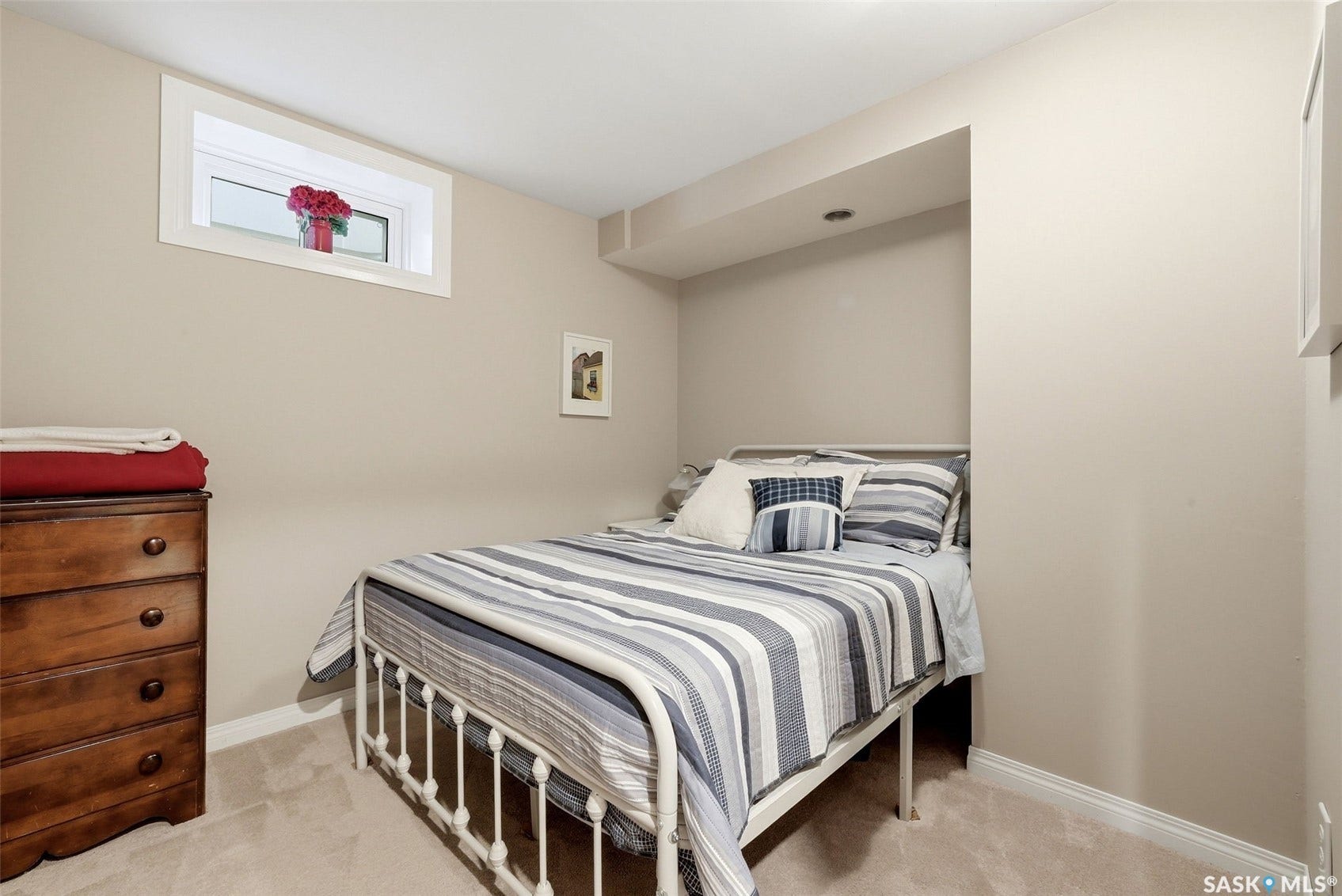 Bright and inviting room currently used as a bedroom. Please note that the existing windows may not meet current egress requirements. Buyers are encouraged to verify bedroom designation and applicable requirements with the appropriate authorities.
