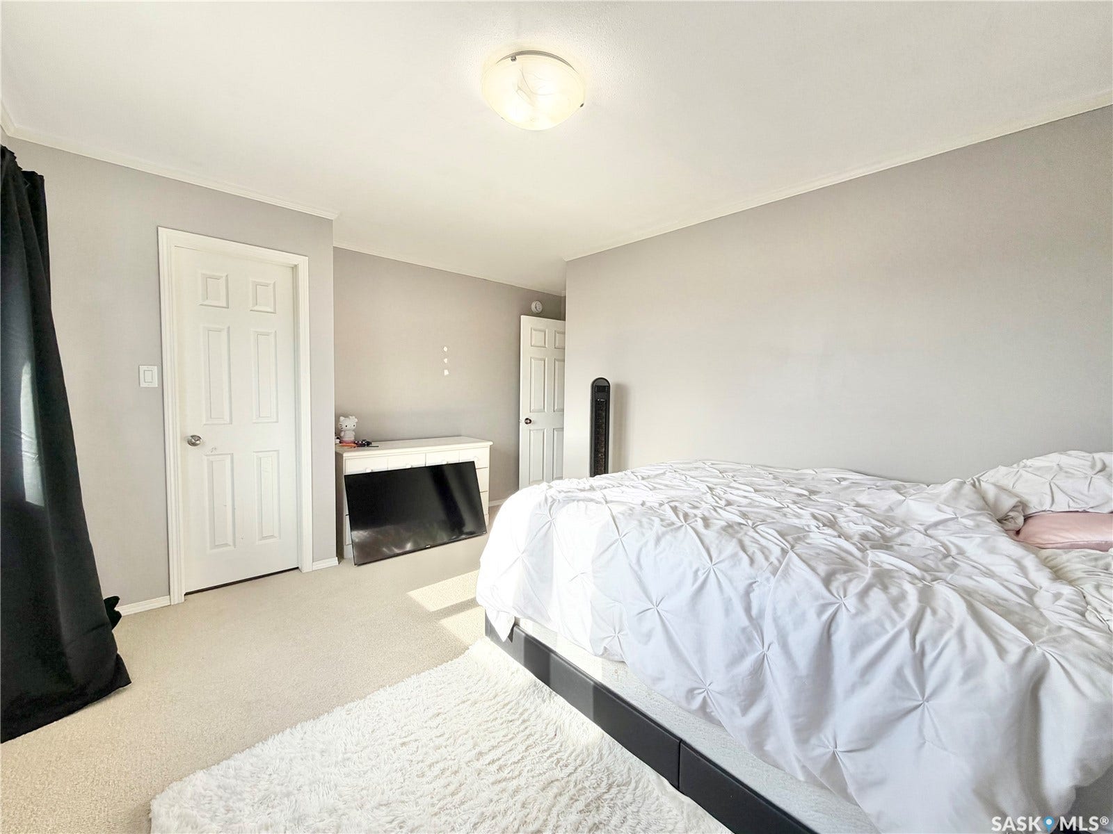 Wall-to-wall carpeting and white interior doors