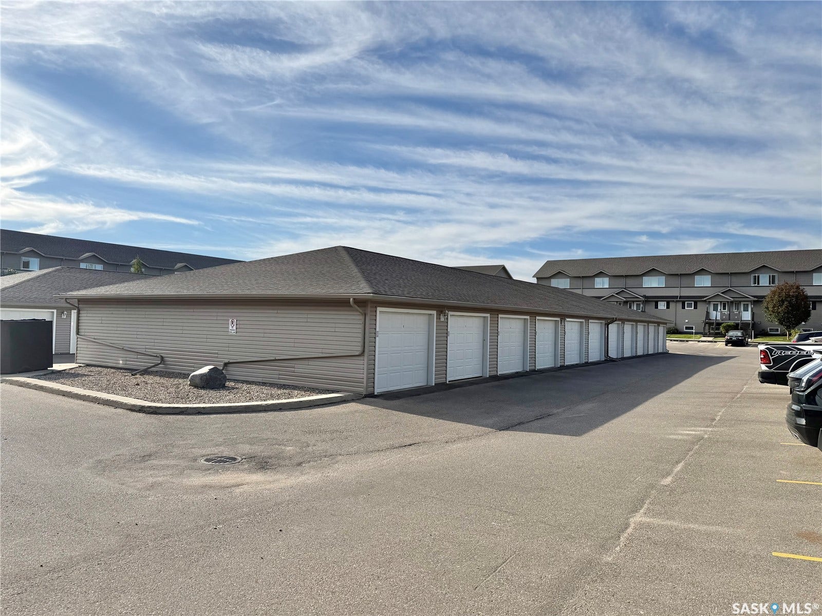Exterior storage building with multiple garage doors