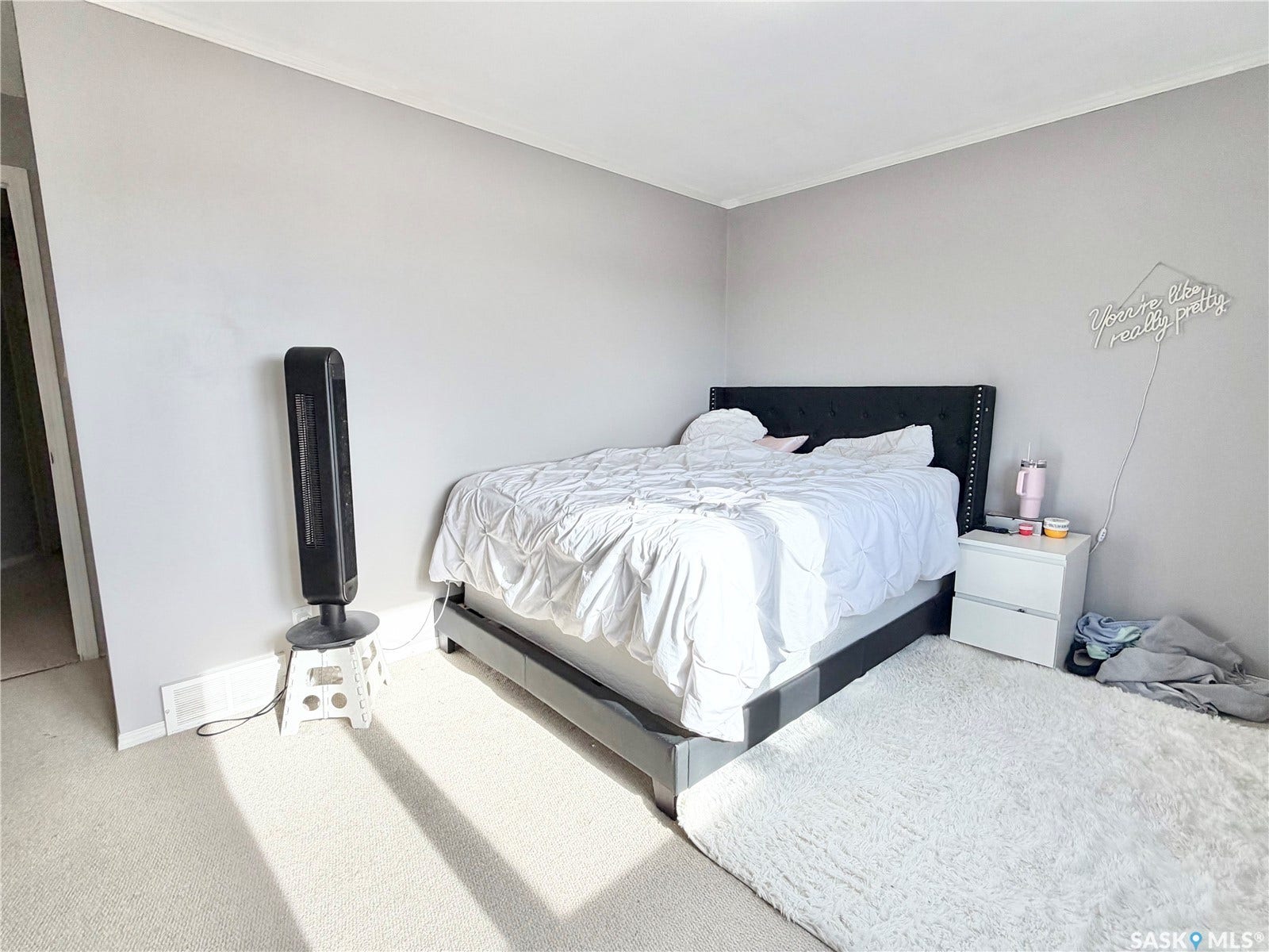 Wall-to-wall carpeting and neutral gray wall paint