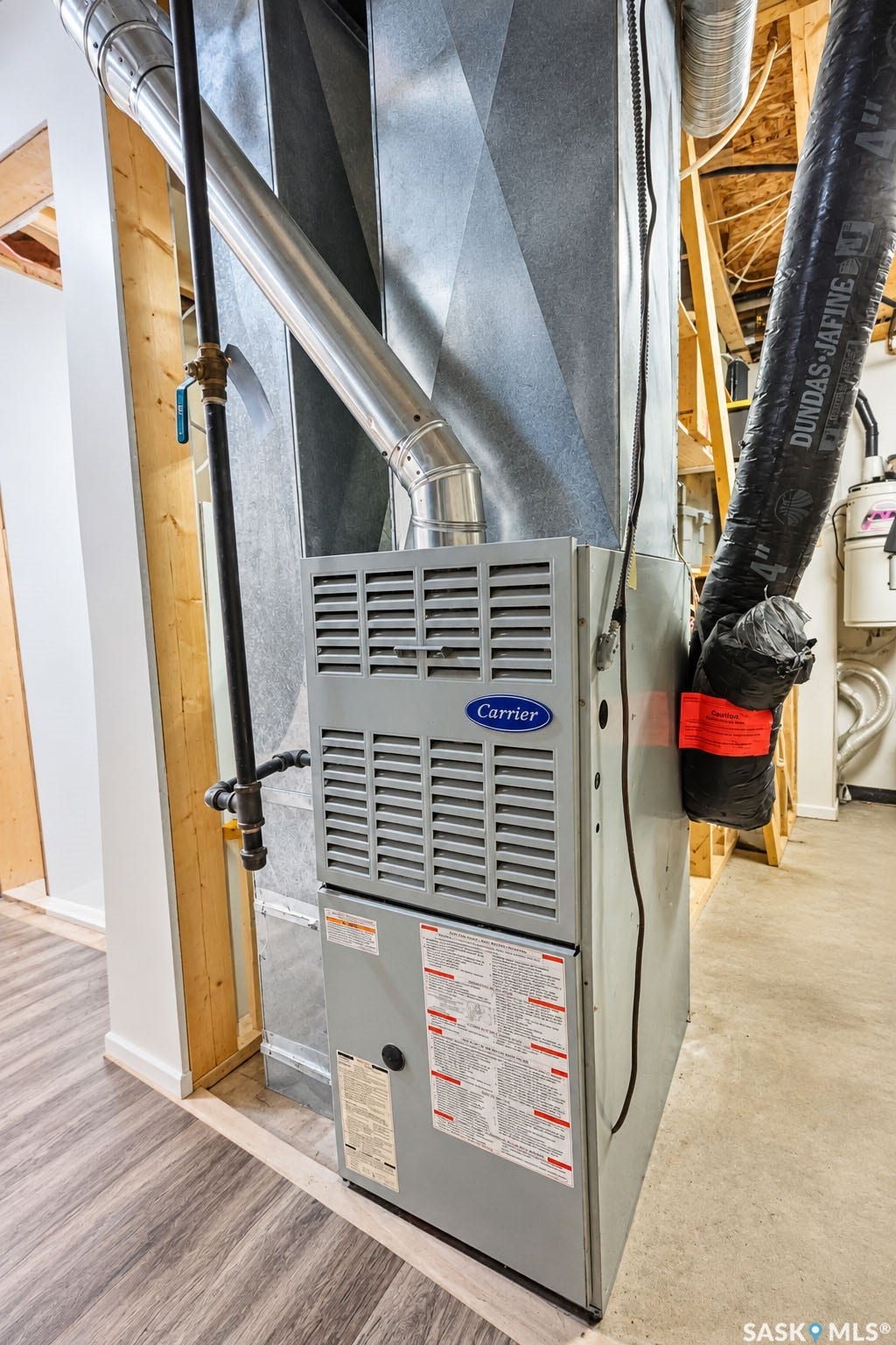 Carrier furnace with galvanized ductwork and wood-finish flooring