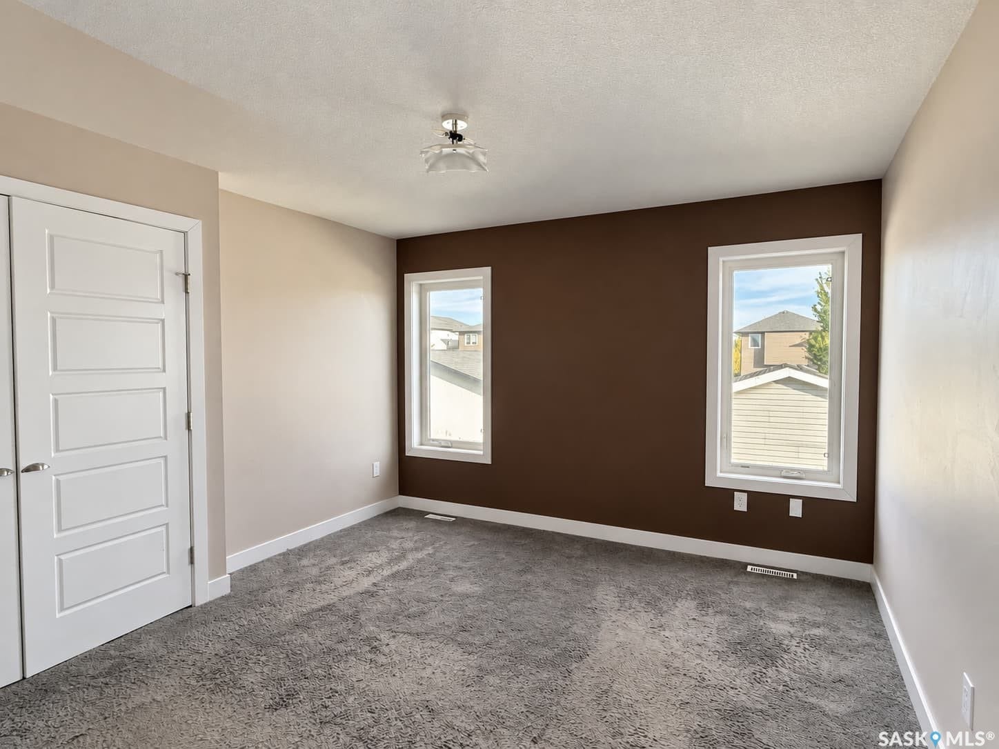 Neutral wall colors with an accent wall and contrasting white trim