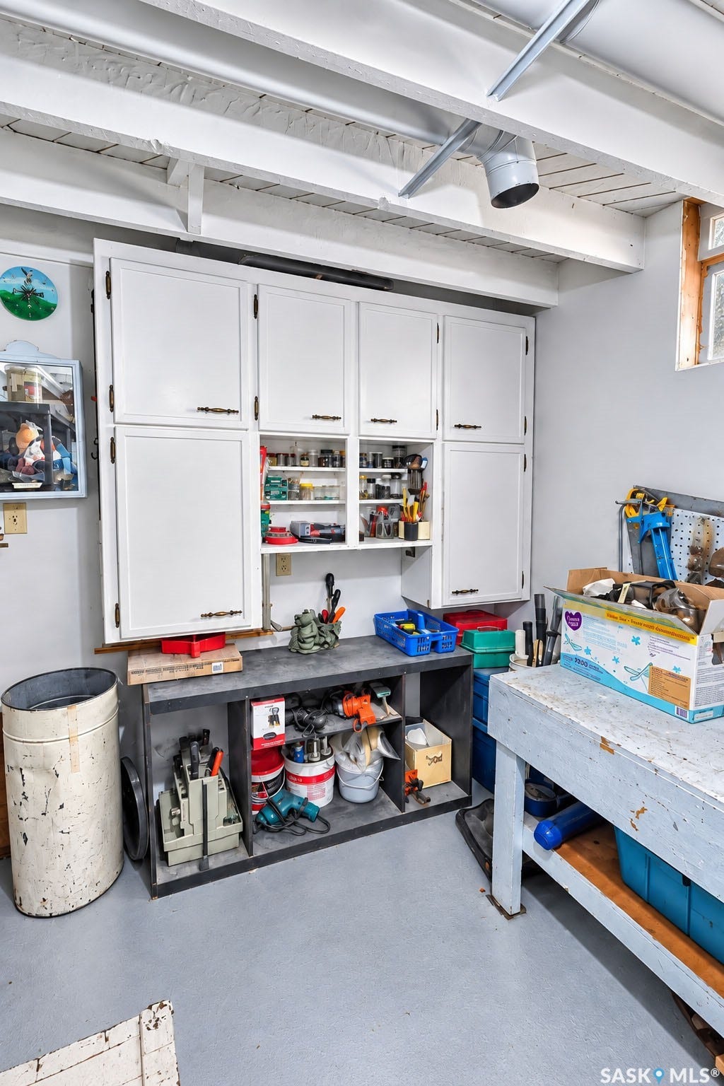 Built-in cabinetry with open shelving and a dedicated workspace