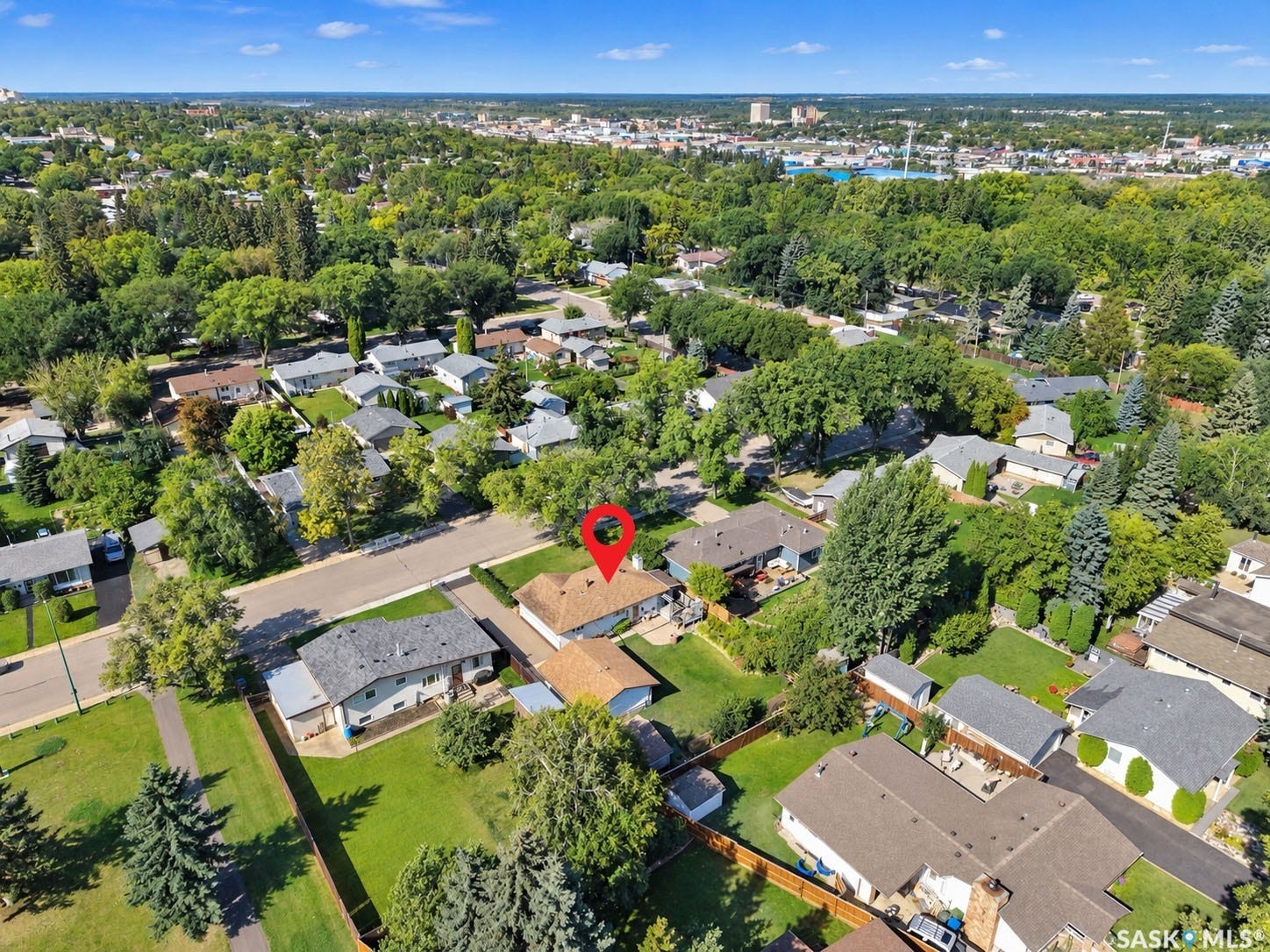 Aerial perspective showcasing a residential neighborhood with ample green space