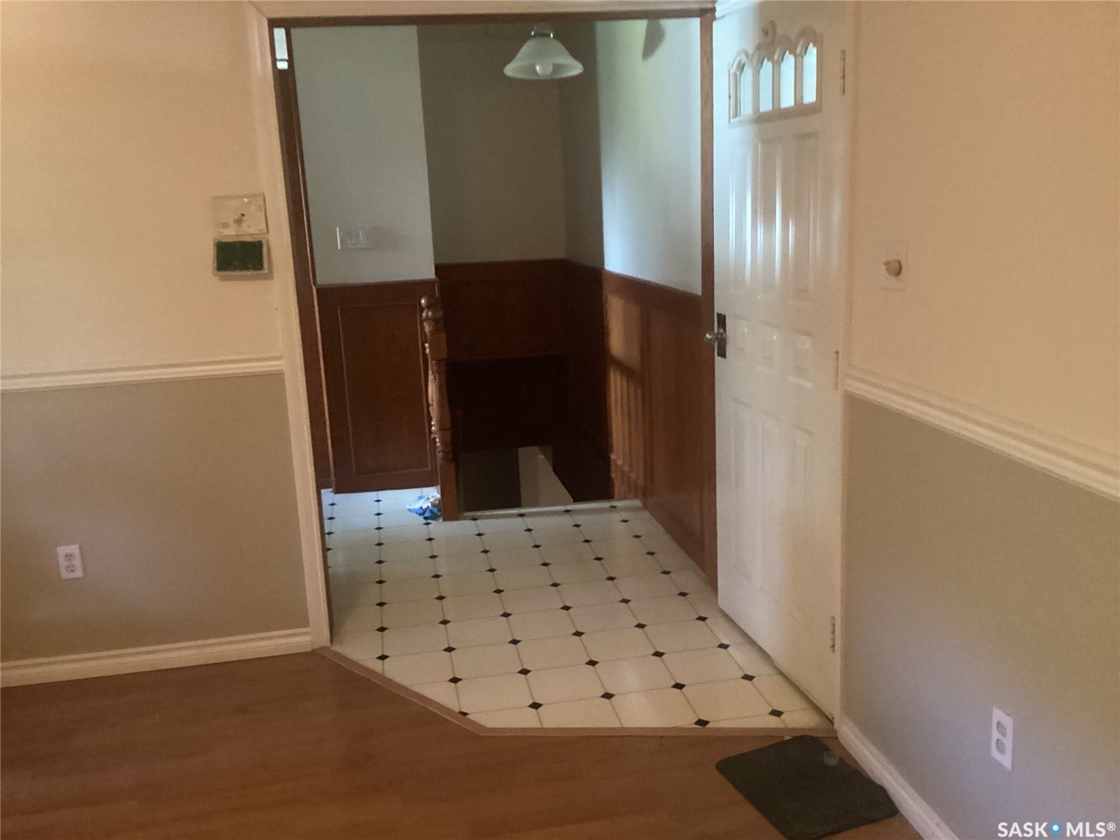 White entry door with decorative glass inserts