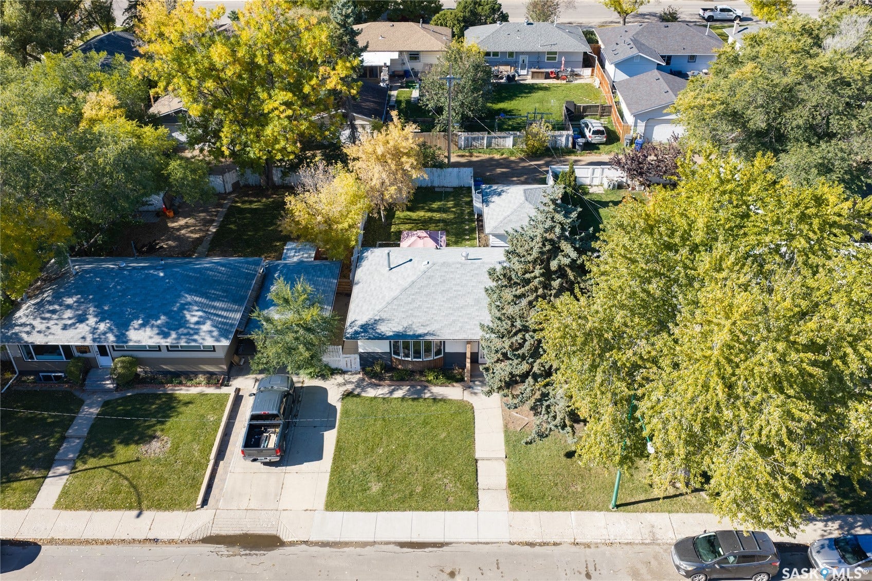 Manicured front lawn with an established privacy hedge