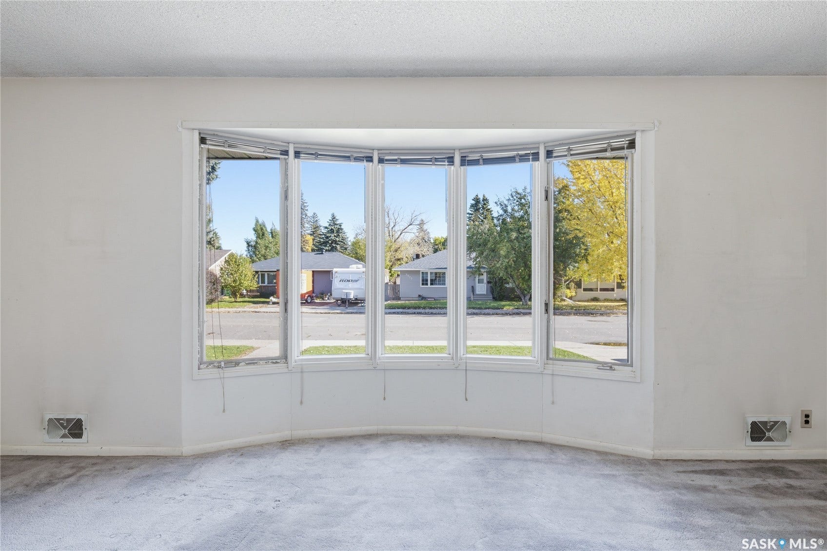Large five-panel bay window with white trim