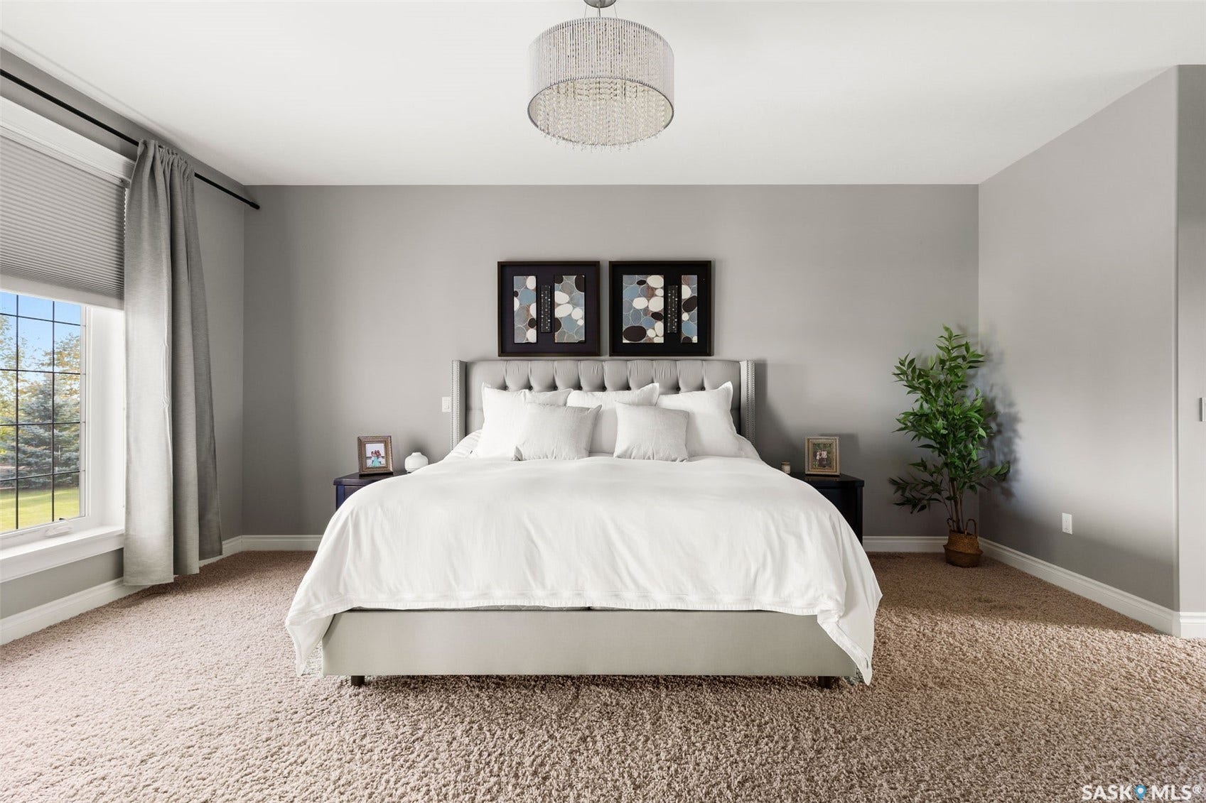Expansive room with neutral carpeting and a large window