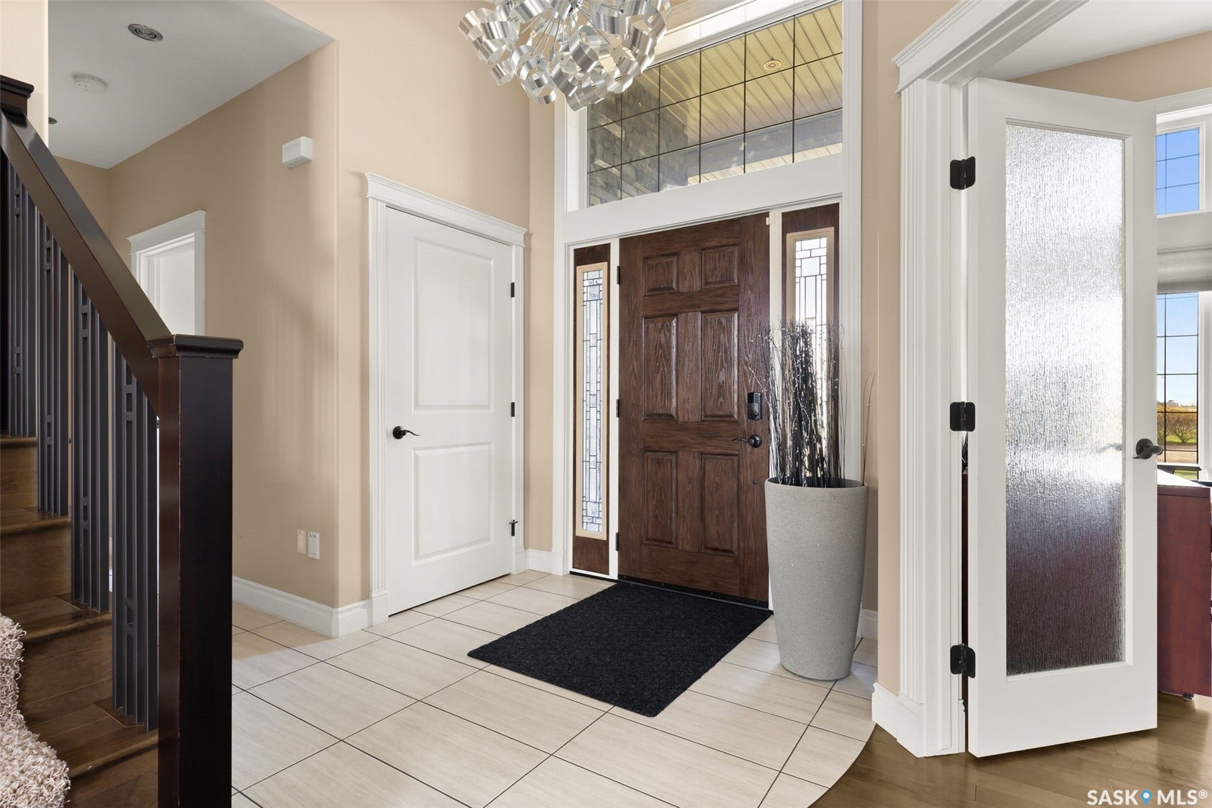 Warm wood-finish entry door with sidelights