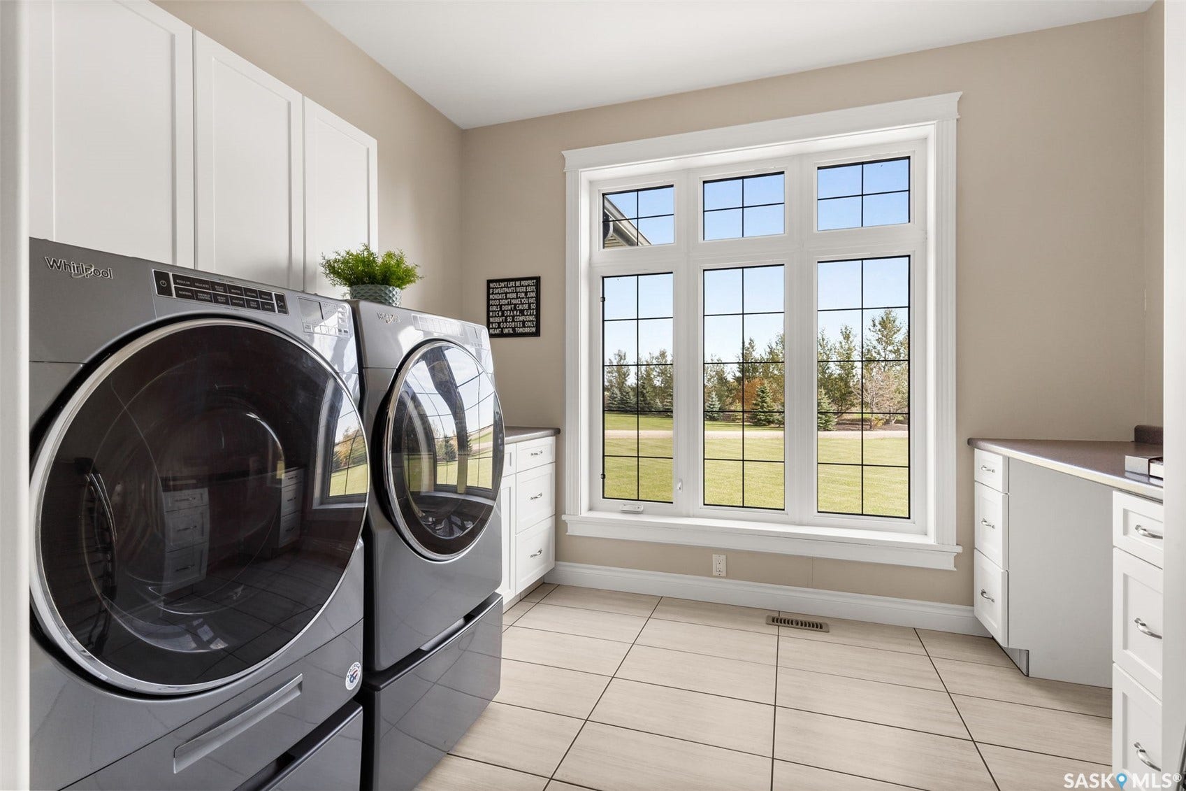 Built-in cabinetry, tile flooring, and a large window with grid panes