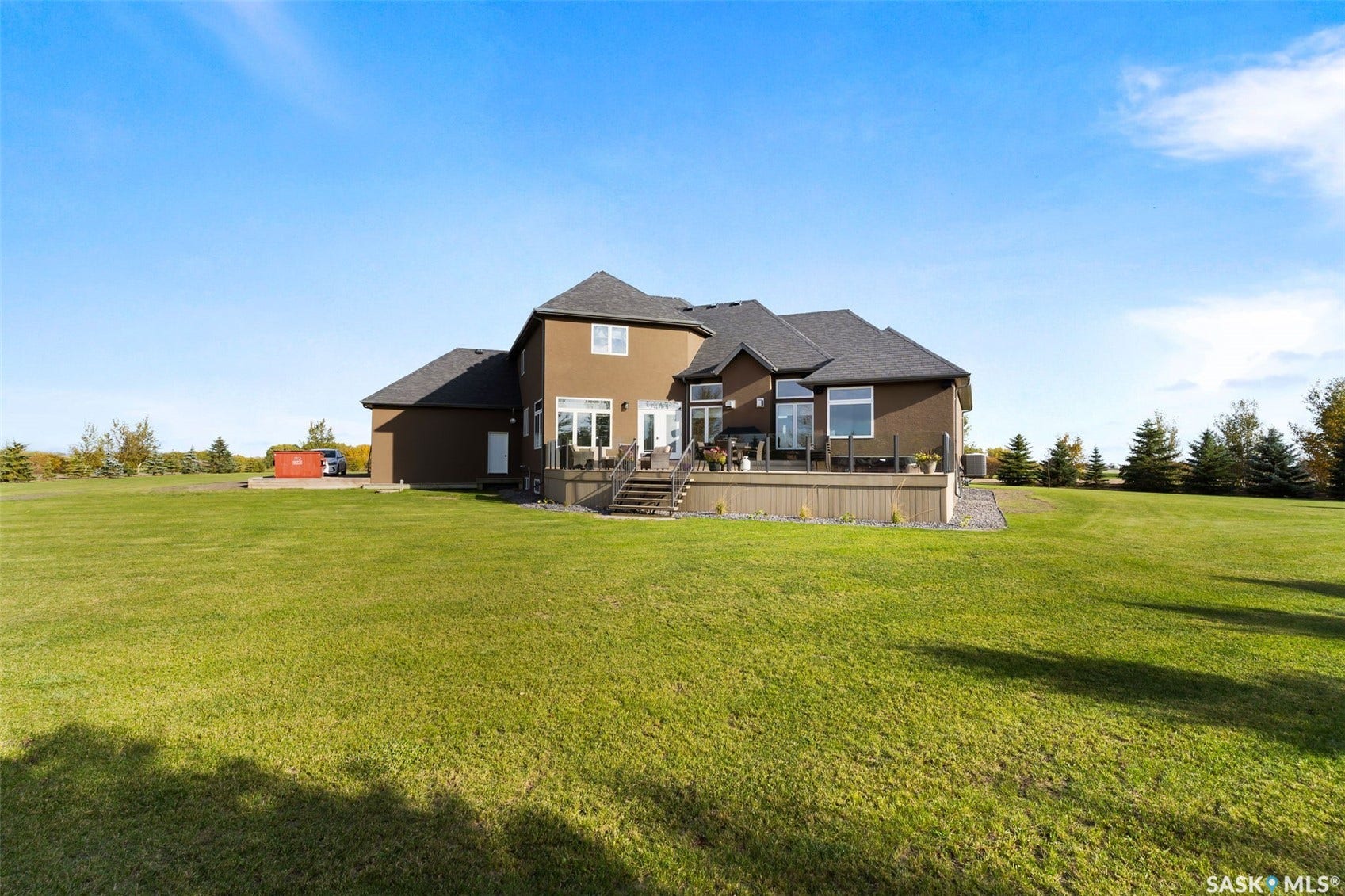 Spacious grounds with a large expanse of manicured lawn