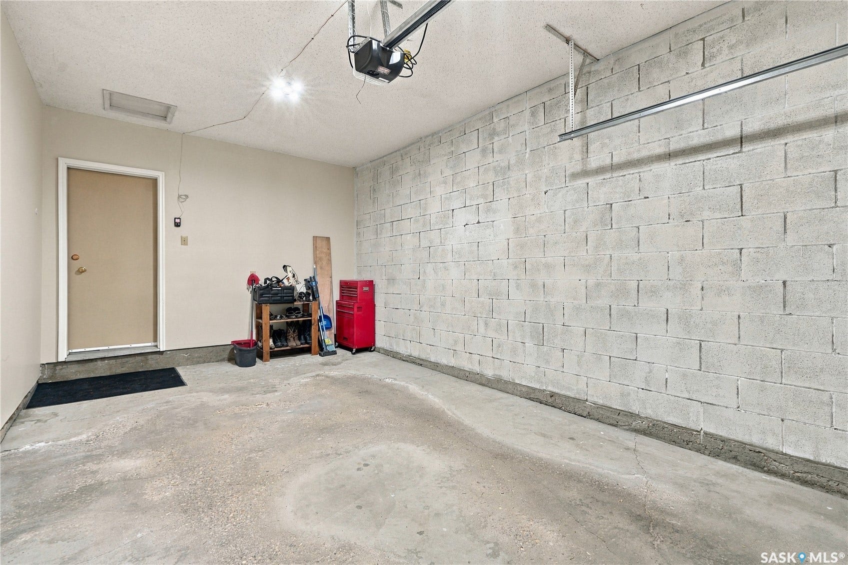Concrete block wall construction, concrete flooring, and an interior access door