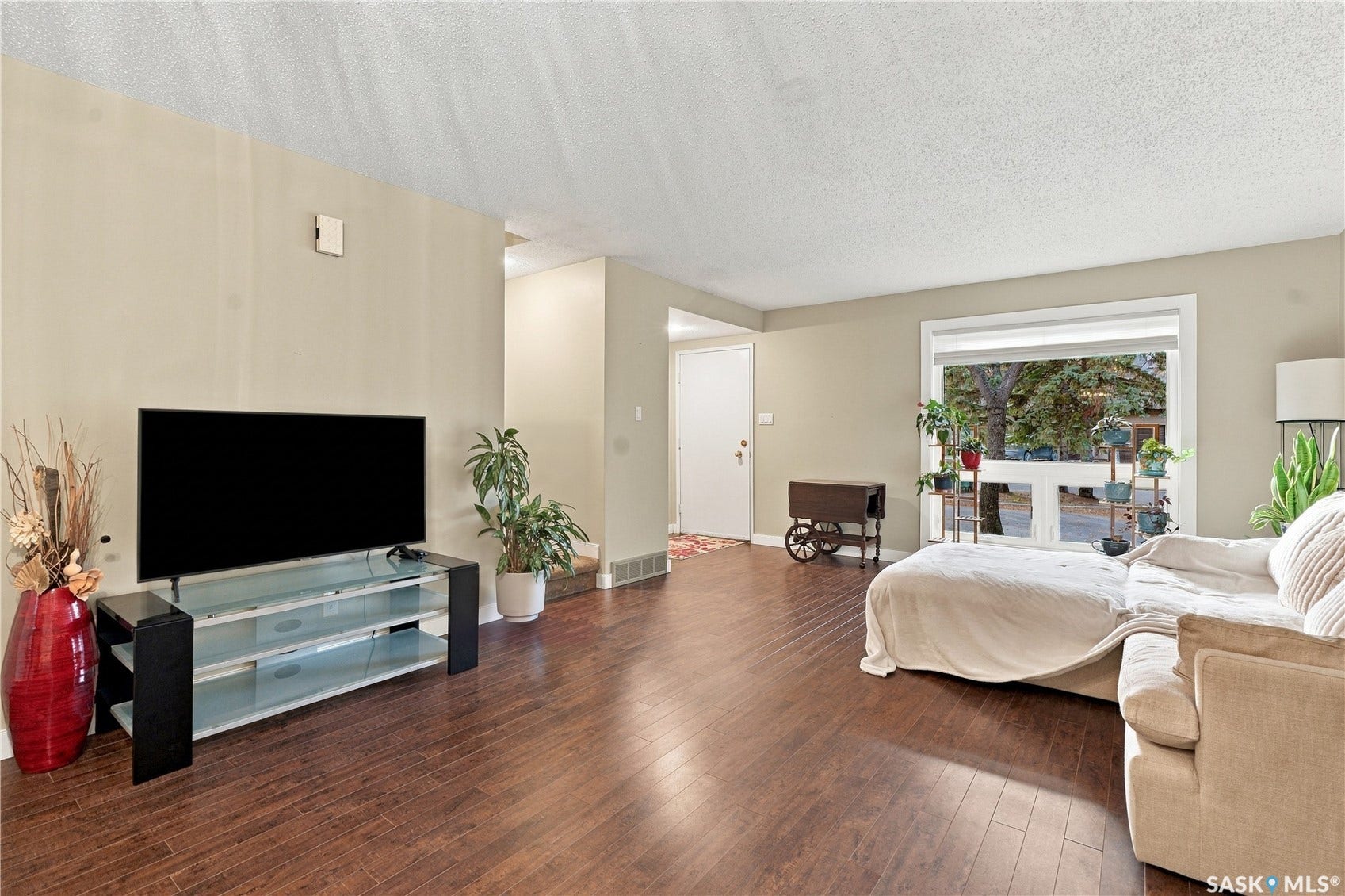 Wood-finish flooring throughout, complemented by light-toned wall finishes