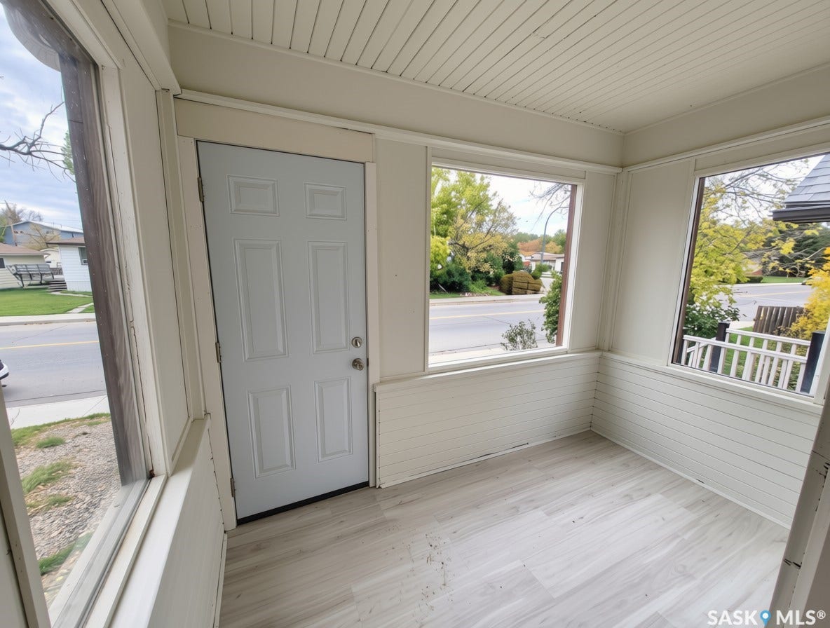 Enclosed porch featuring new vinyl plank flooring, multiple windows, beadboard ceiling, and horizontal paneling